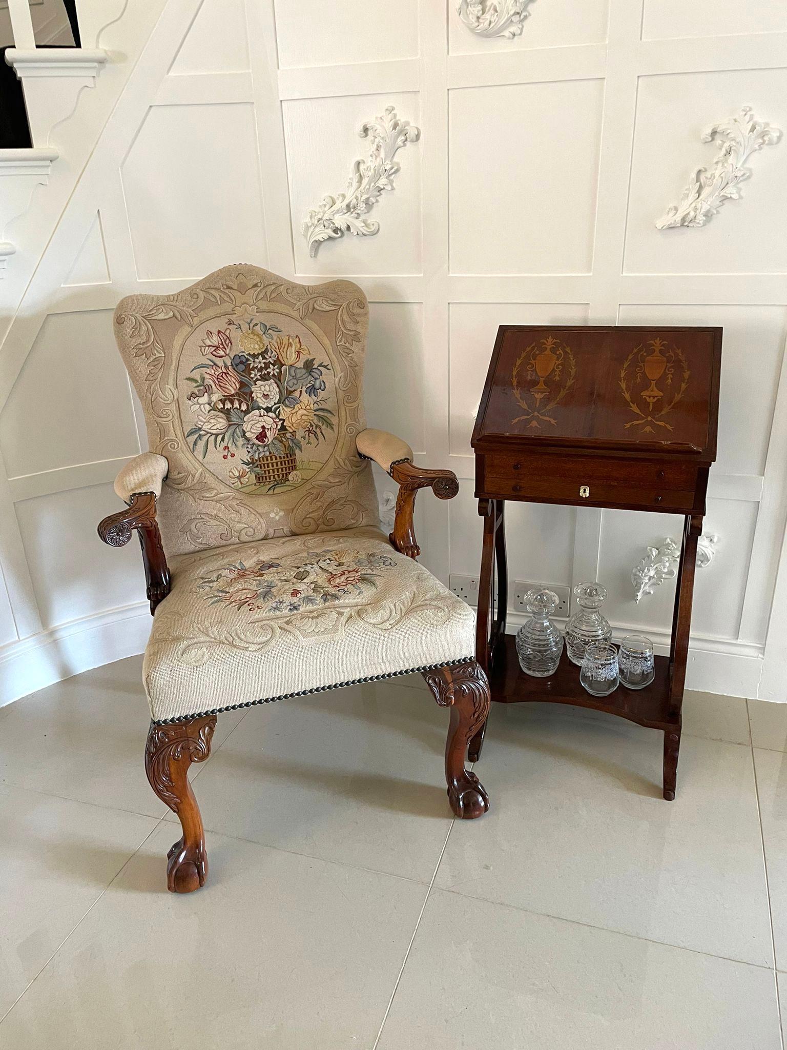 Outstanding quality antique carved mahogany library chair having a fantastic upholstered tapestry back and seat, outstanding quality carved mahogany shaped open arms and standing on outstanding quality carved mahogany shaped cabriole legs with claw