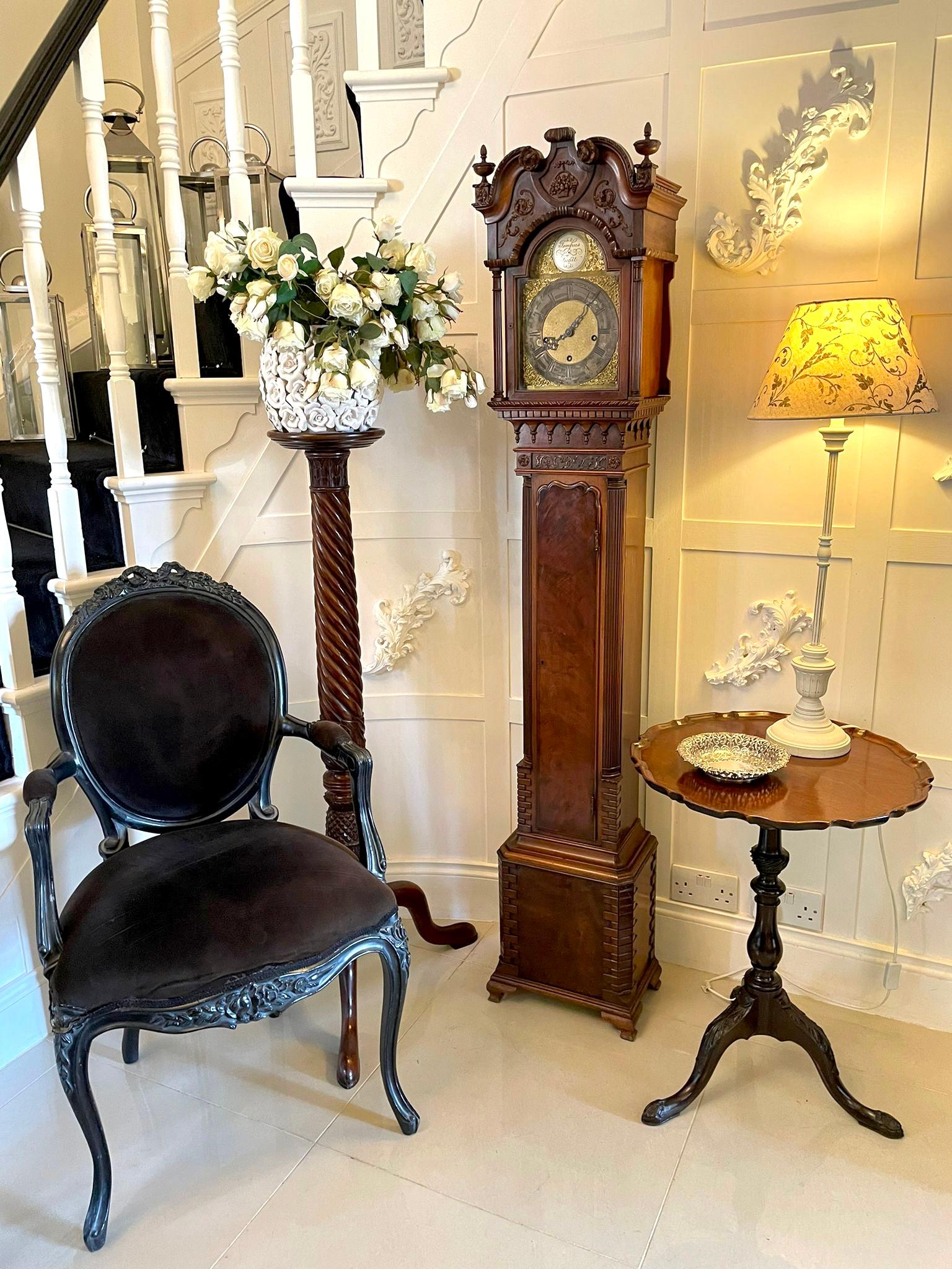 Outstanding quality antique chippendale style carved mahogany grandmother clock with the case being a quality and outstandingly carved example with a carved mahogany swan neck pediment, carved finals, glazed arched shaped door flanked by fine reeded