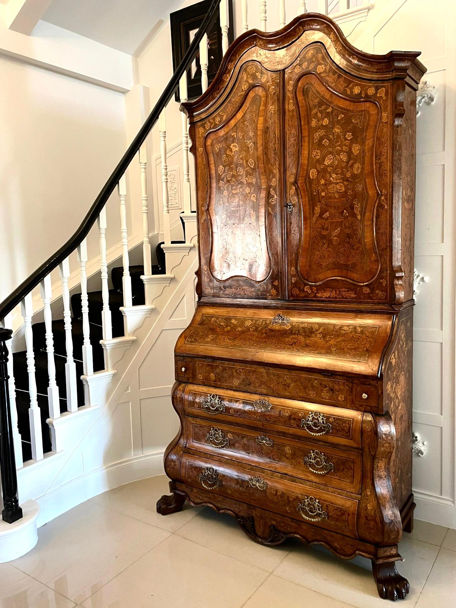 Outstanding quality 18th century antique Dutch marquetry inlaid burr walnut bureau bookcase having an outstanding quality Dutch marquetry inlaid burr walnut bureau bookcase with a shaped cornice above a pair of marquetry inlaid panelled doors