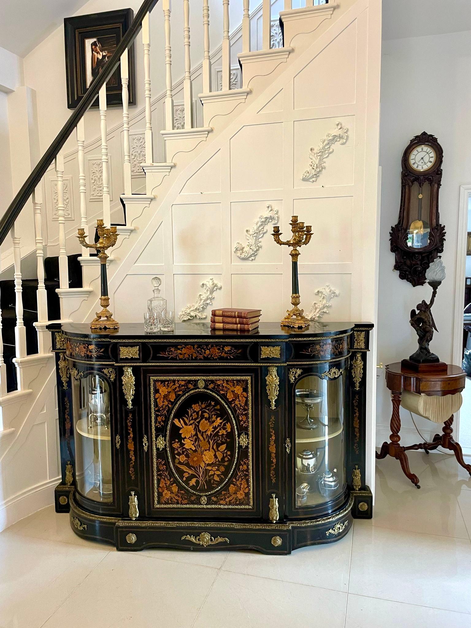 Outstanding quality antique Victorian ebonised and inlaid floral marquetry credenza/sideboard having a ebonised shaped top above an inlaid floral marquetry frieze with ornate ormolu mounts above a majestic inlaid floral marquetry door flanked by two
