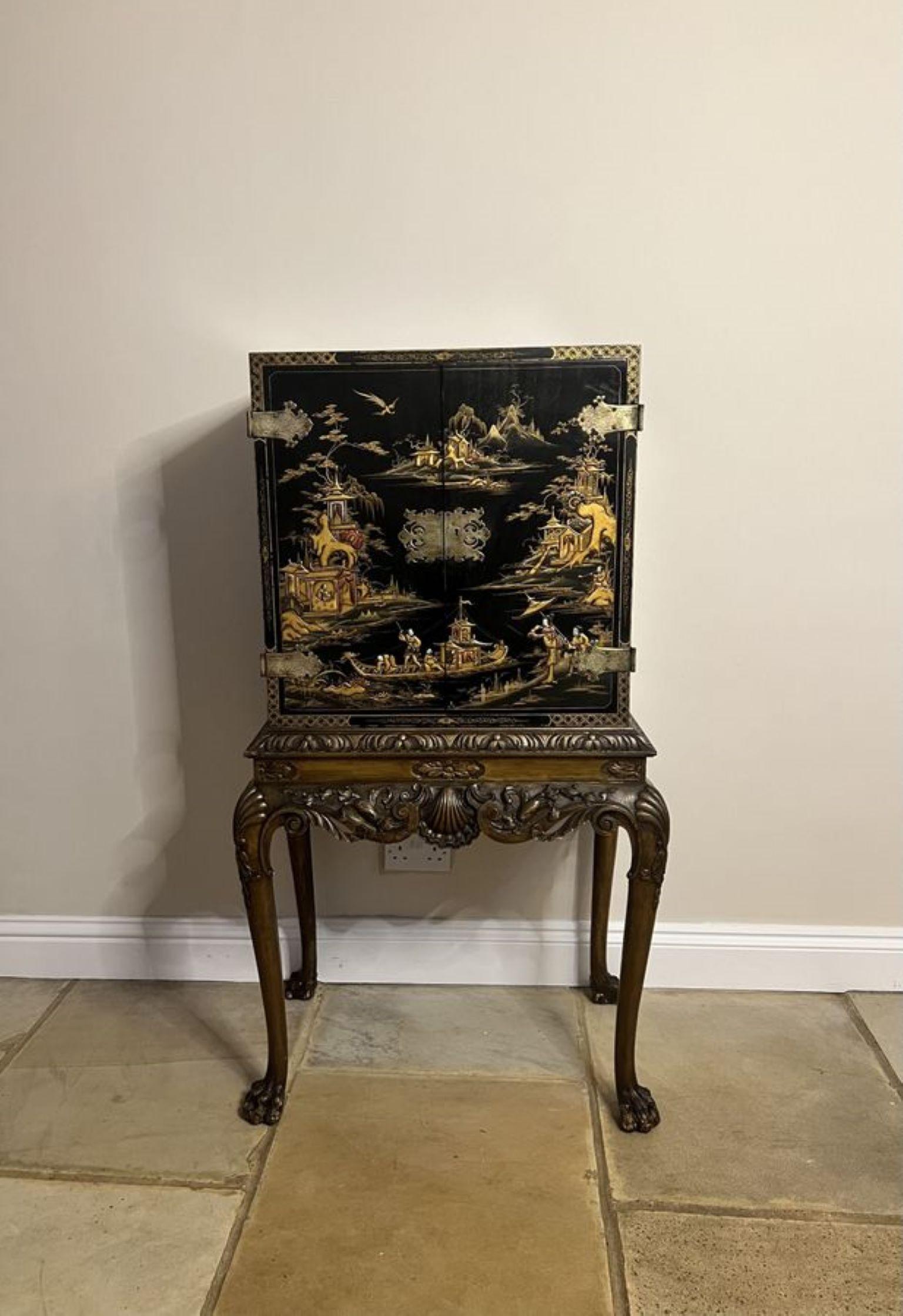 Outstanding quality antique Edwardian chinoiserie decorated cabinet on a stand, having a pair of outstanding quality chinoiserie decorated doors with original ornate brass hinges and lock plate, opening to reveal a shelf interior, chinoiserie