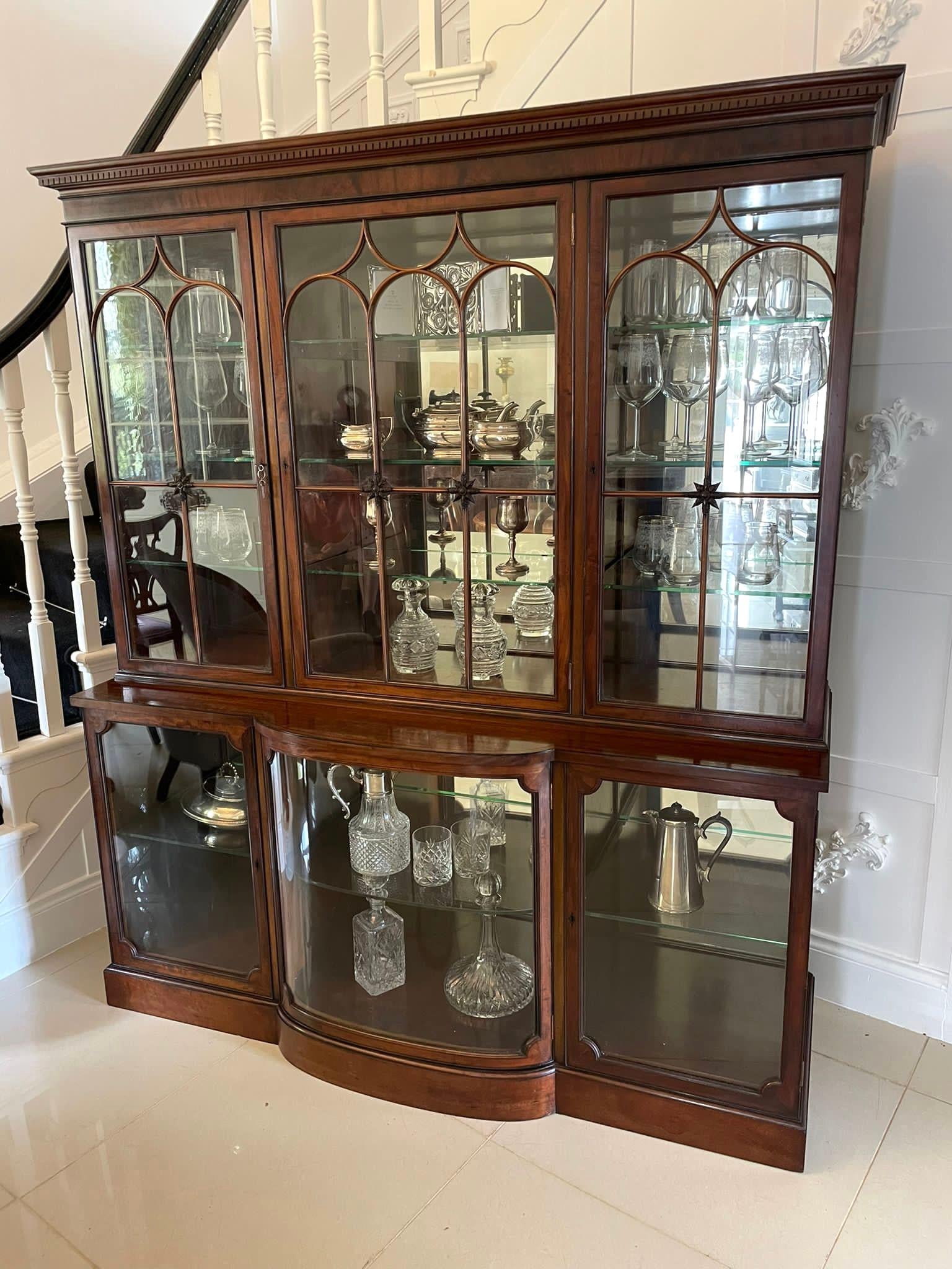 Outstanding quality antique Edwardian mahogany astral glazed display cabinet having a moulded cornice above a figured mahogany frieze with pretty inlaid ebony stringing above three outstanding quality astral glazed and carved mahogany doors with