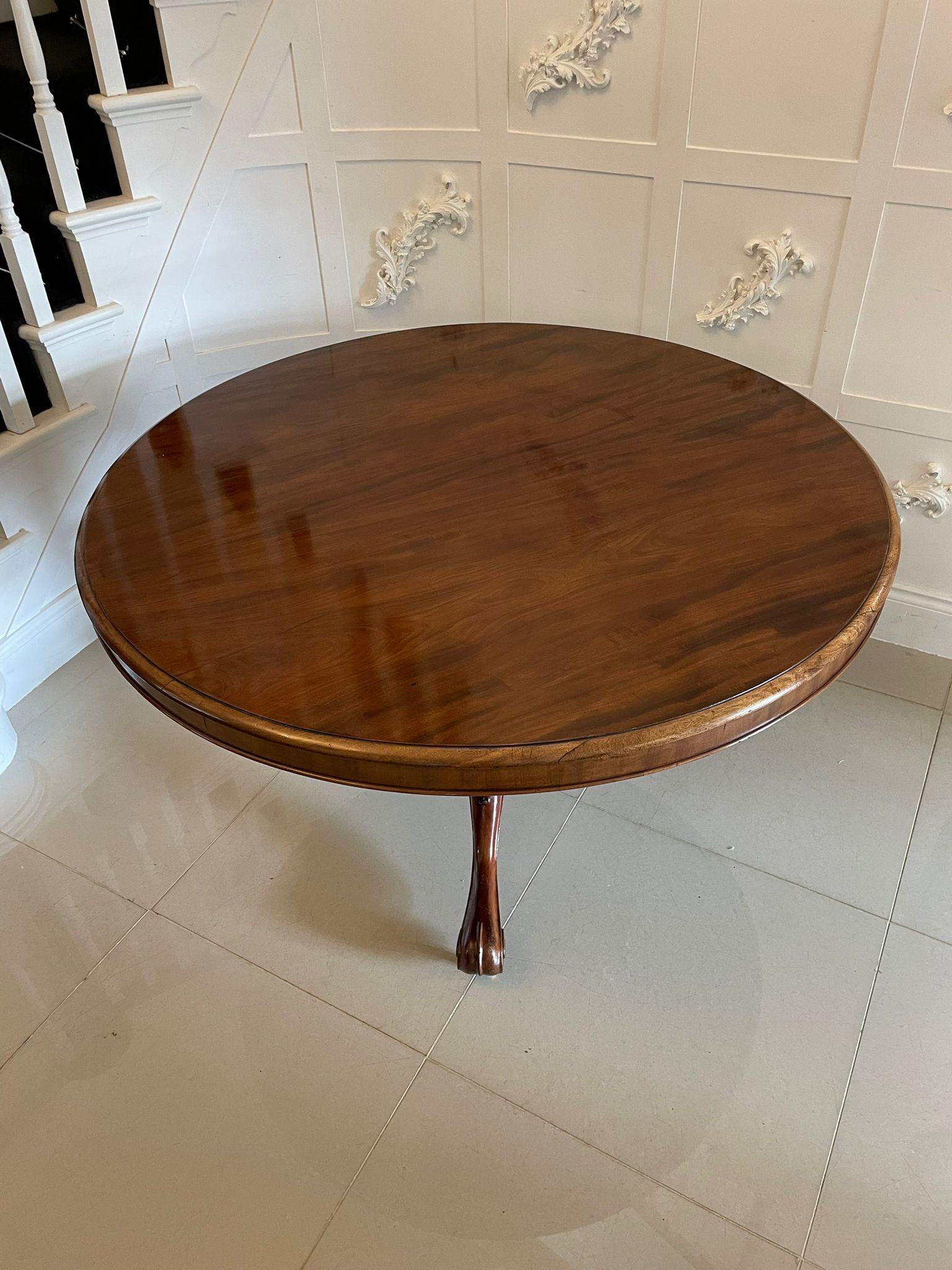 Outstanding quality antique Victorian figured mahogany 6 seater circular dining/centre table having an outstanding quality figured mahogany circular tilt top with a moulded edge, circular mahogany frieze supported by a turned carved mahogany