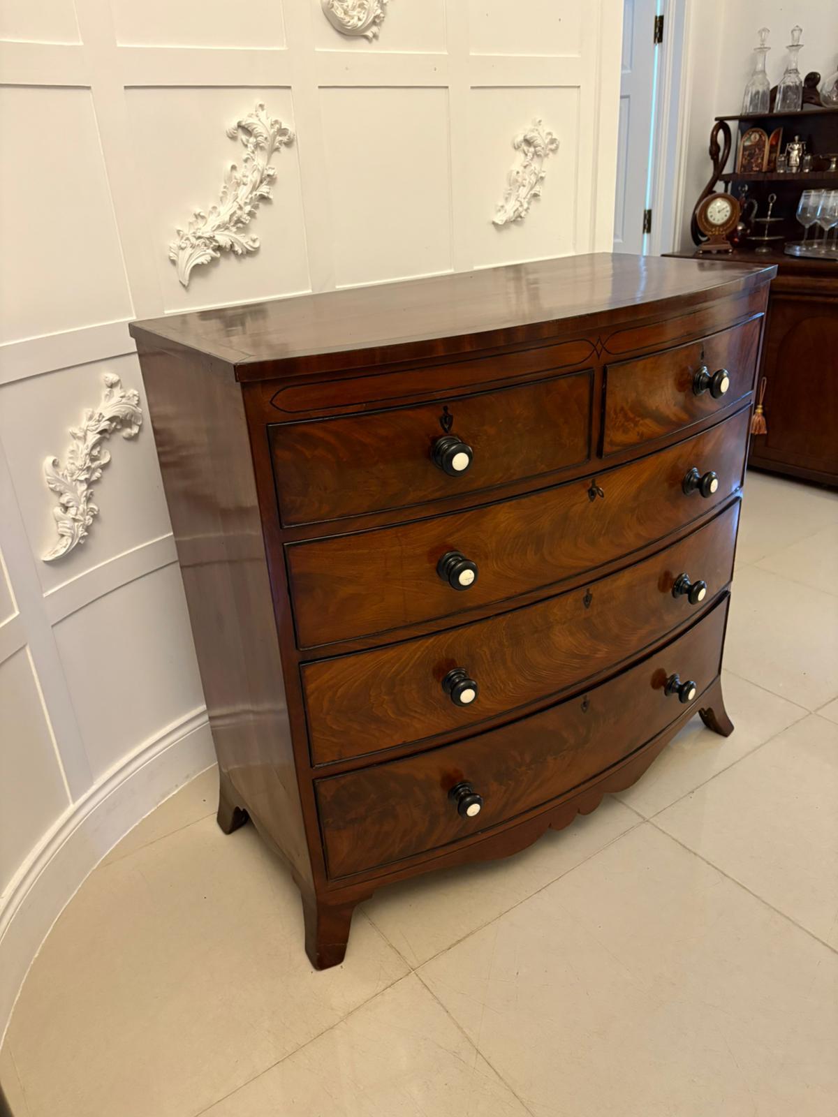 Outstanding quality antique George III figured mahogany bow fronted chest of 5 drawers having an outstanding quality figured mahogany bow fronted top crossbanded with ebony stringing inlay, superb ebony inlaid front above two short and three long