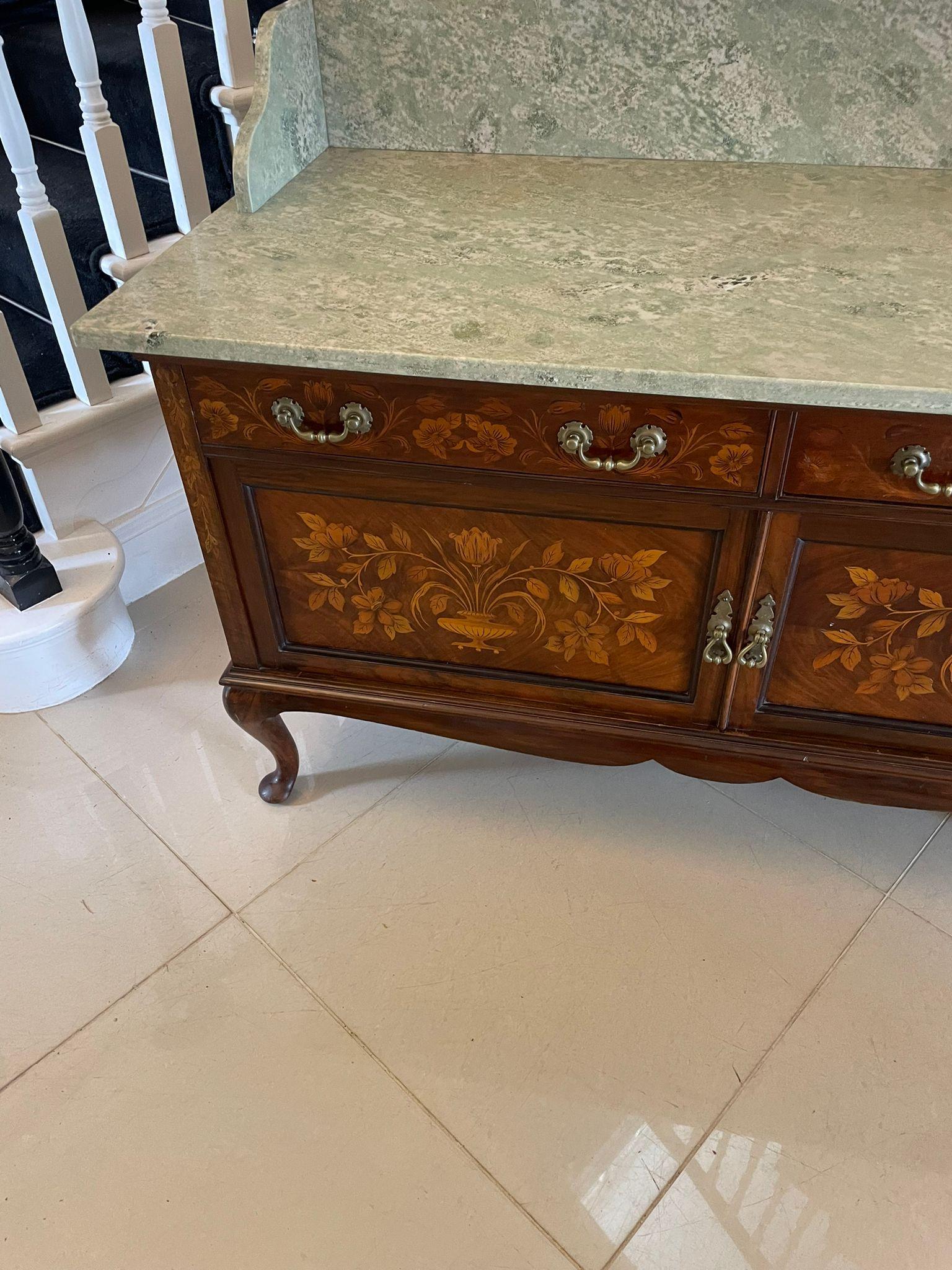 Outstanding quality antique Victorian figured walnut floral marquetry inlaid marble top washstand/cabinet having an outstanding quality light and dark green coloured marble top above two figured walnut floral marquetry inlaid drawers with original