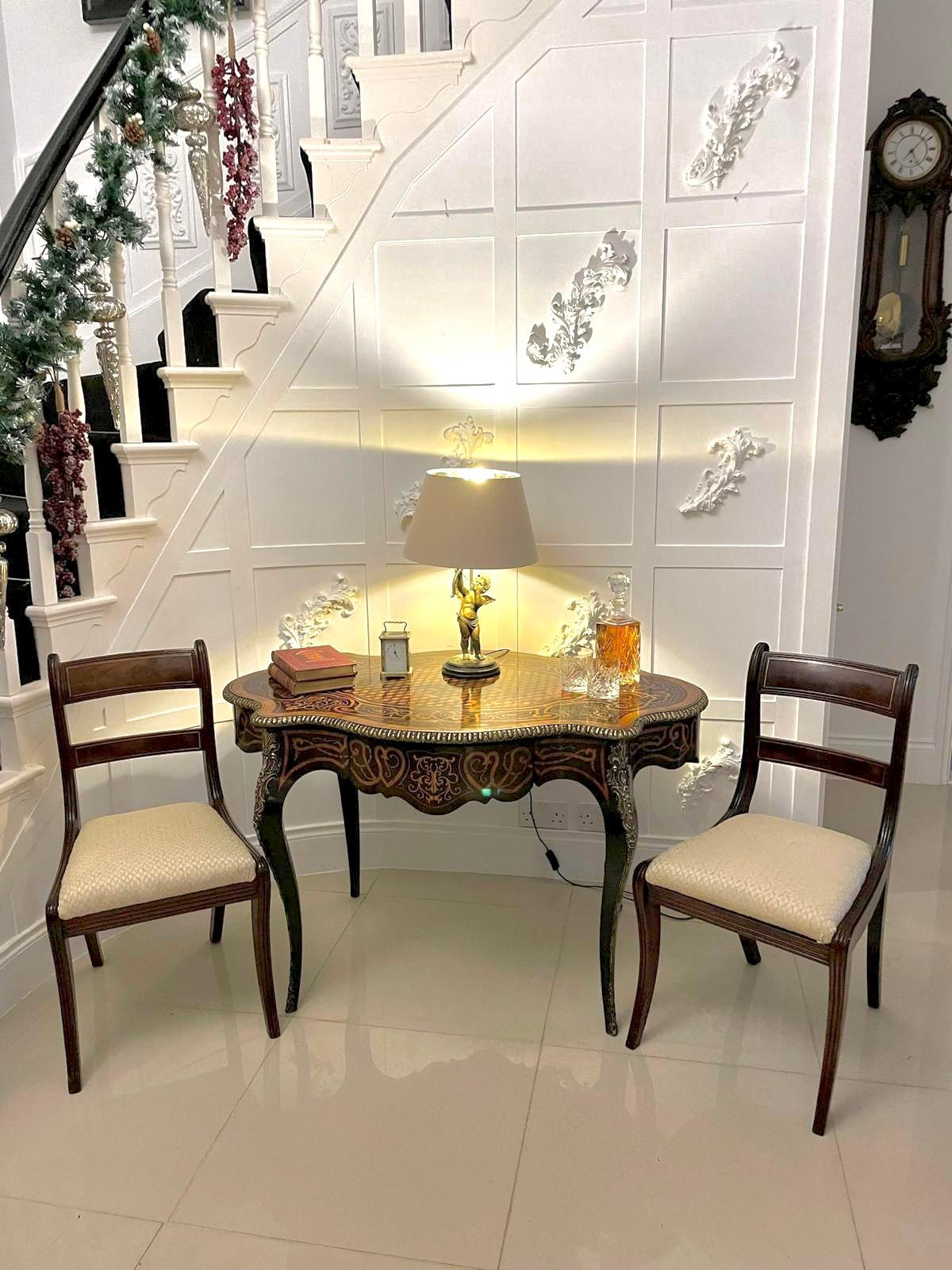 Outstanding quality antique Victorian French freestanding marquetry and parquetry centre table 
having a magnificent quality serpentine shaped marquetry and parquetry inlaid top with an ornate ormolu edge, inlaid marquetry serpentine shaped frieze
