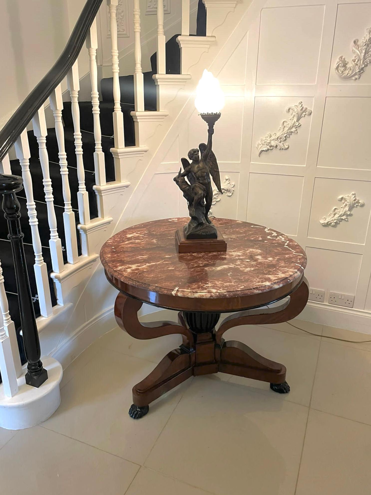 Outstanding quality antique French Victorian marble top centre table having an outstanding quality circular coloured marble top with a moulded edge above a mahogany circular frieze supported by three scroll shaped scrolls and a ebonised shaped
