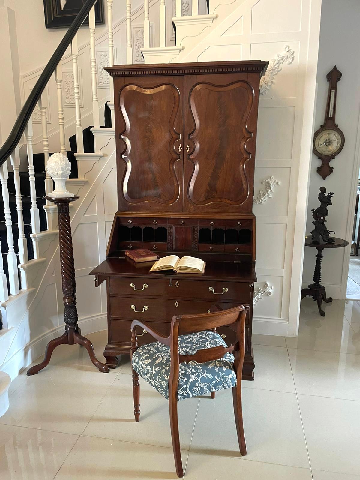 Outstanding quality antique George II figured mahogany bureau bookcase having an outstanding quality figured mahogany top with unusual shaped panelled doors opening to reveal a fitted interior consisting of four drawers, four pigeon holes and two