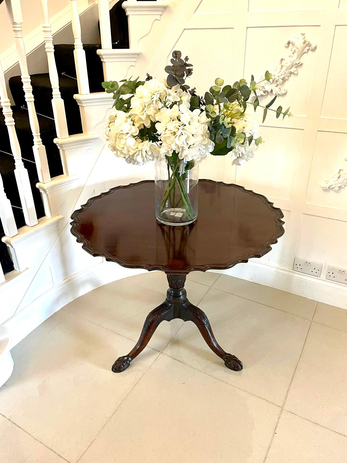 Outstanding quality antique George III mahogany centre table having a wonderful figured mahogany tilt top with a pie crust edge supported on a turned shaped carved mahogany pedestal column standing on shaped carved cabriole legs with claw feet 


A