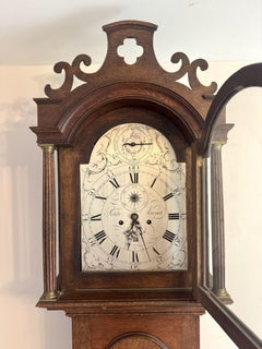 Outstanding quality antique George III oak arched dial long case clock