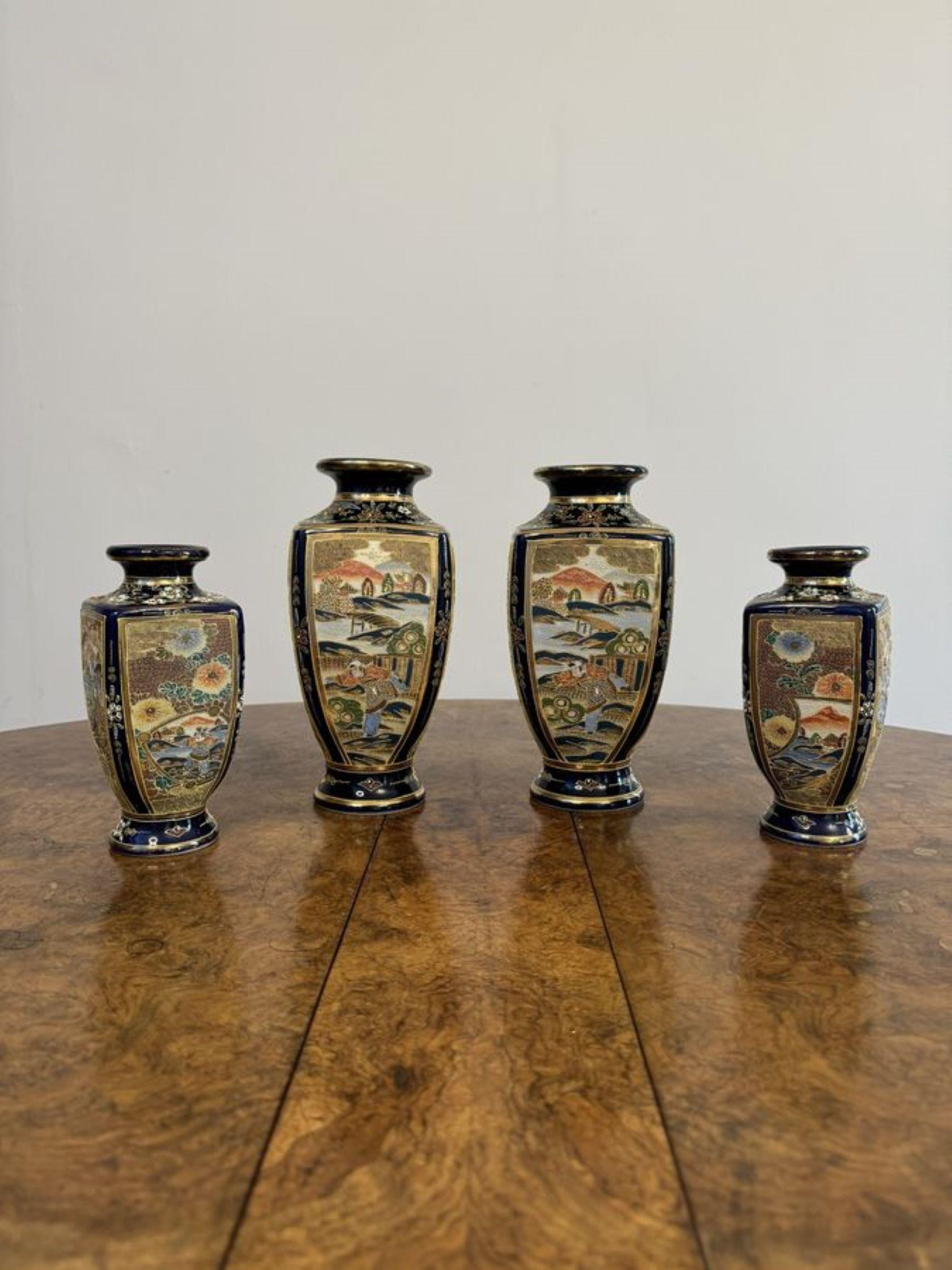 Outstanding quality antique Japanese satsuma vase garniture, having a quality garniture of shaped Japanese Satsuma vases with gilded circular shaped tops, with fantastic detailed hand painted decoration of figural and landscape scenes within blue