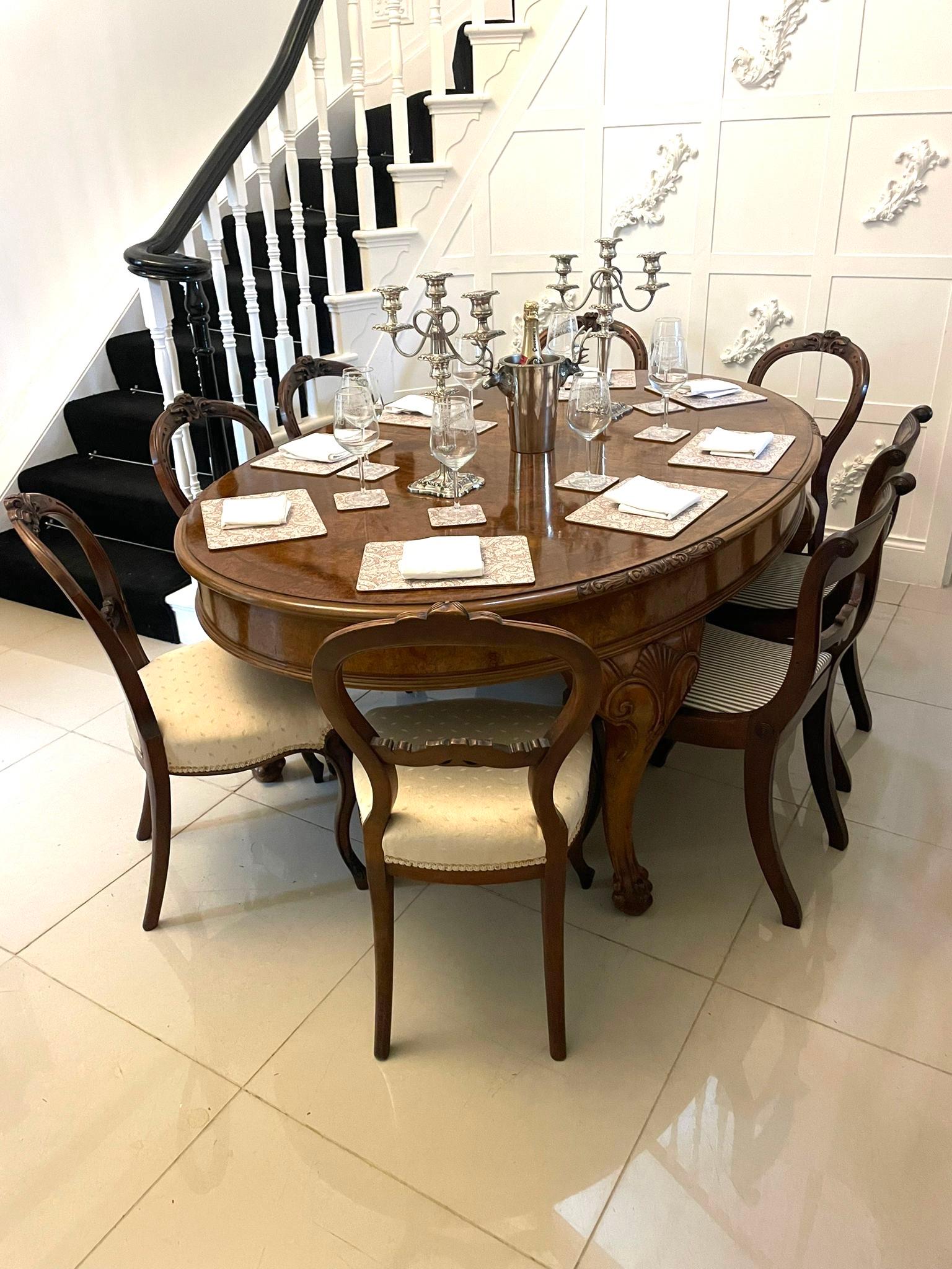Outstanding quality antique oval burr walnut 8 seater dining table having an outstanding quality oval shaped burr walnut top with a carved and moulded edge, burr walnut frieze with a moulded edge standing on four solid walnut carved cabriole legs