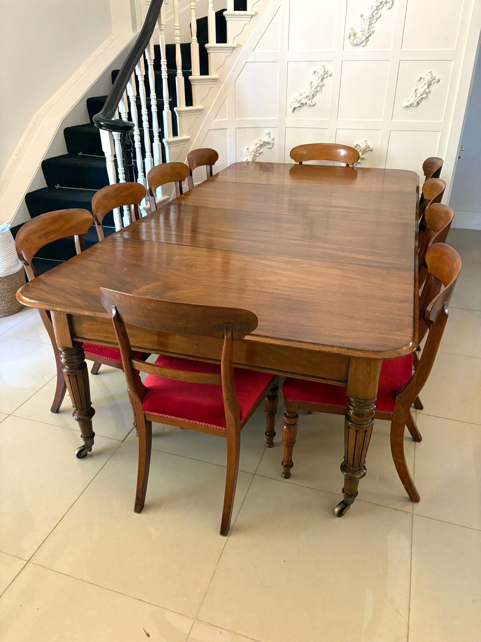 Outstanding quality antique Regency figured mahogany 10 seater extending dining table having a quality figured mahogany extending top with a moulded edge and 2 original extra leaves, pull out extending action standing on elegant turned tapering
