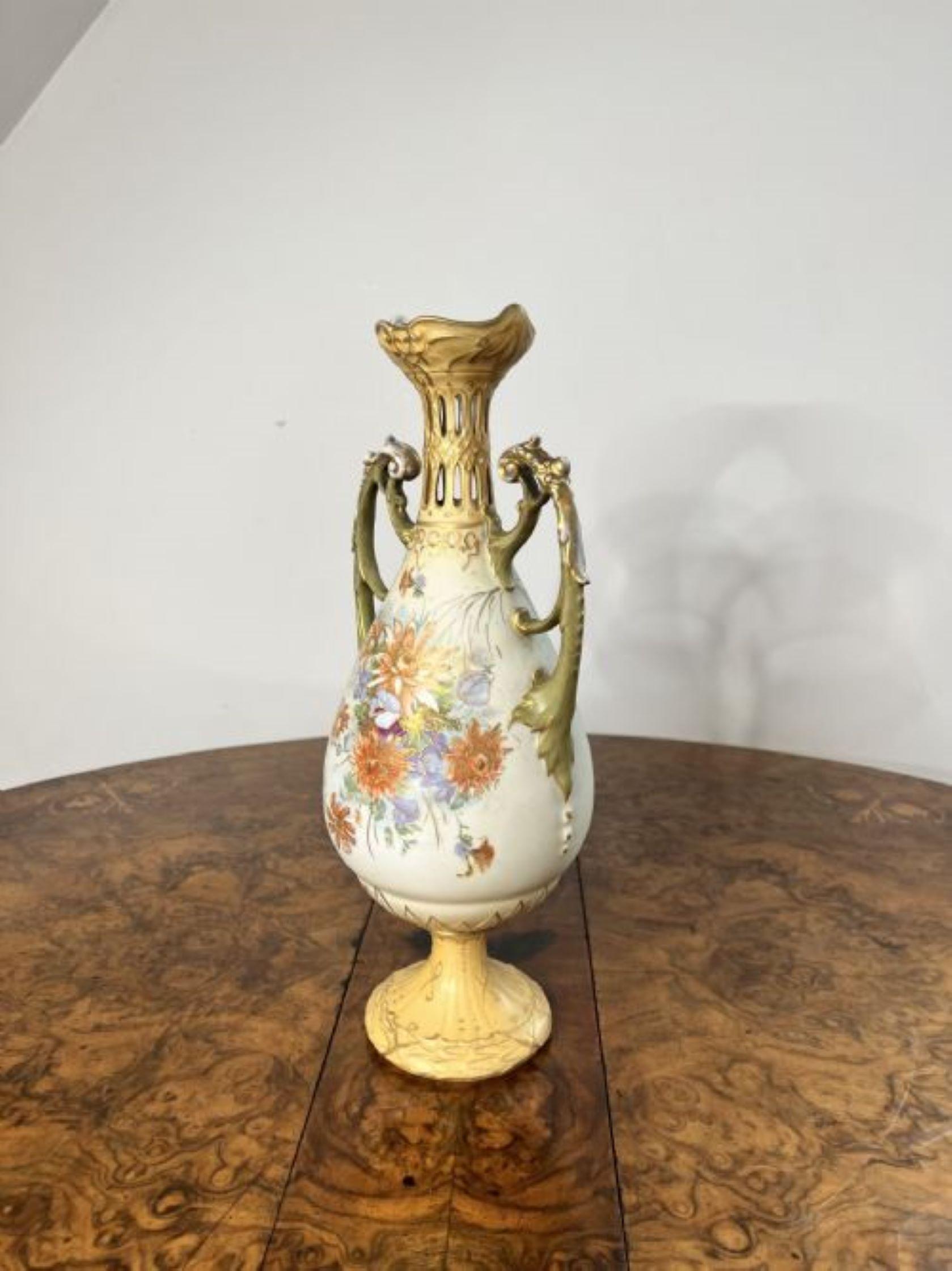 Outstanding quality antique Royal Vienna centrepiece and side vases, comprising of two vases with pierced necks and the centrepiece having a pierced base, gold gilded twin shaped handles to the sides, decorated with flowers in stunning green,