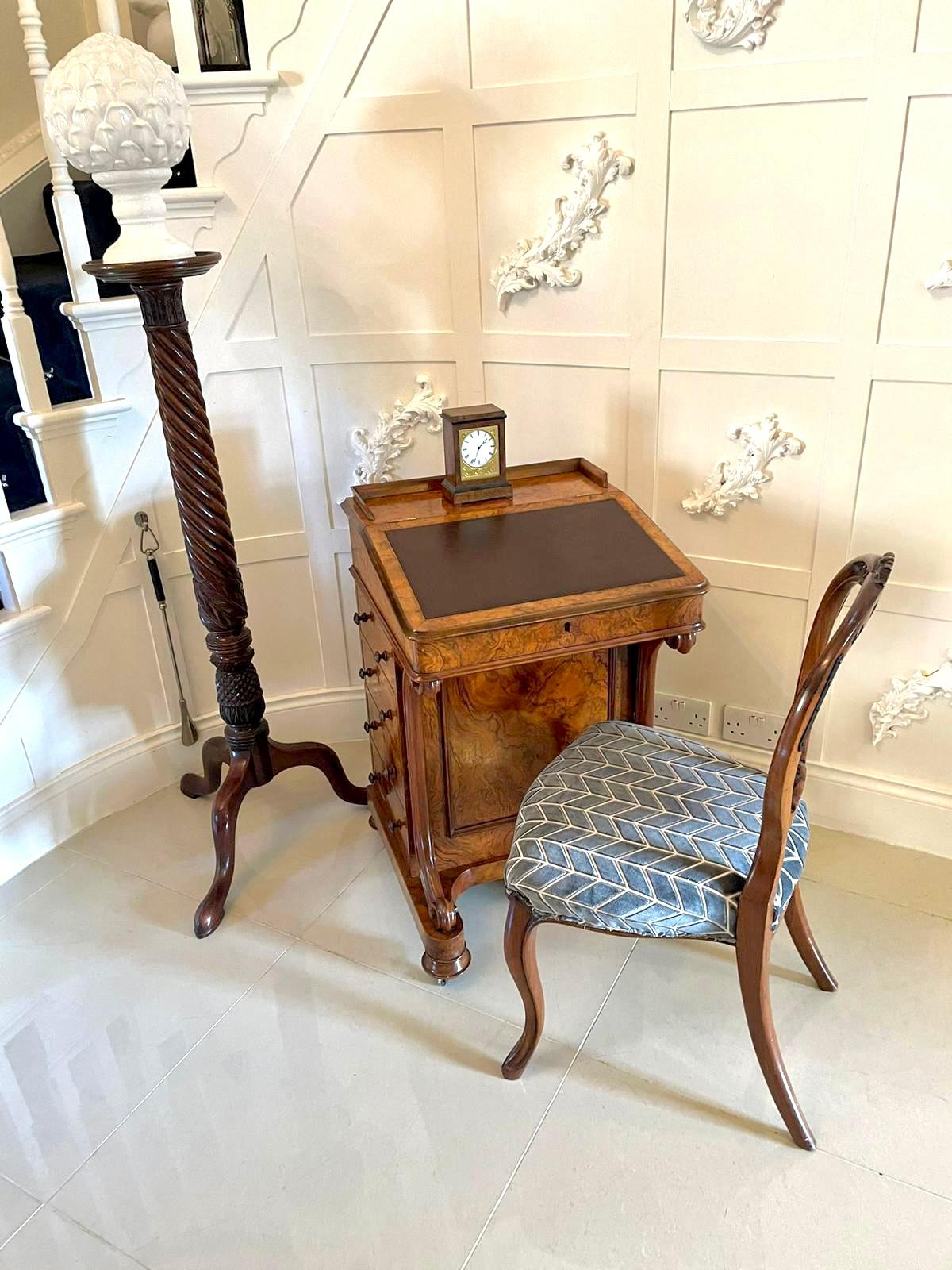 Outstanding quality antique Victorian burr walnut davenport having a gallery top above a lift up lid with a brown leather writing surface crossbanded in walnut. The lid opens to reveal a fitted interior and to the right hand side are four working