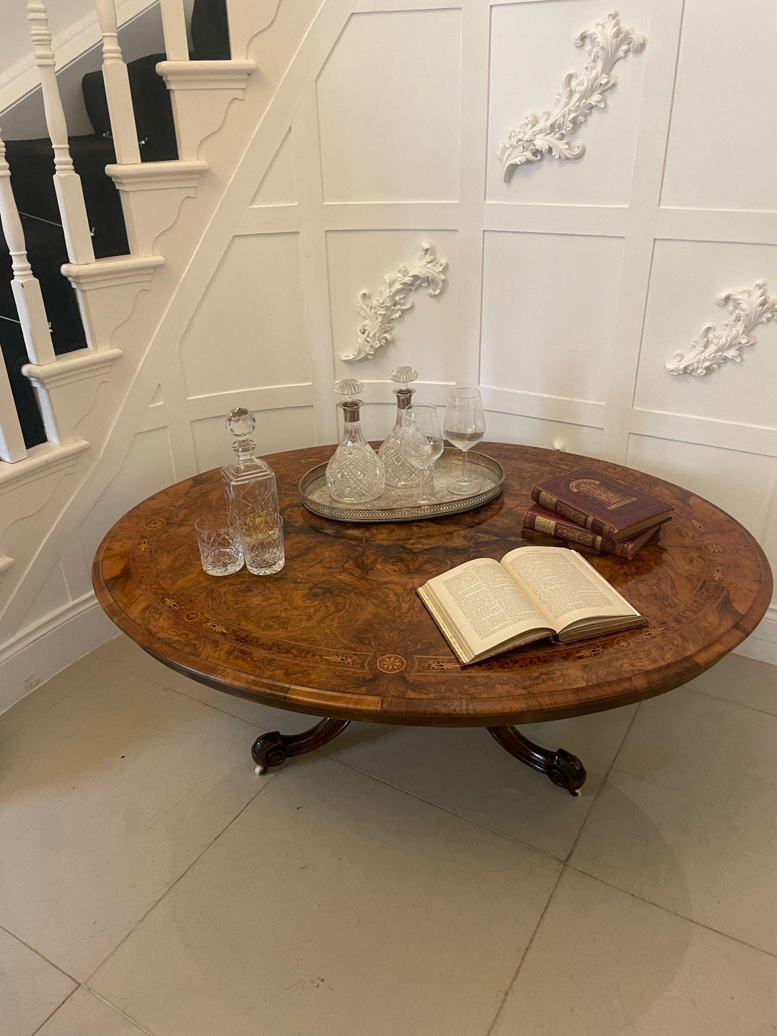 Outstanding quality antique Victorian burr walnut inlaid oval coffee table having a magnificent quality burr walnut inlaid oval shaped top with a thumb moulded edge supported by a turned carved solid walnut pedestal column standing on four shaped