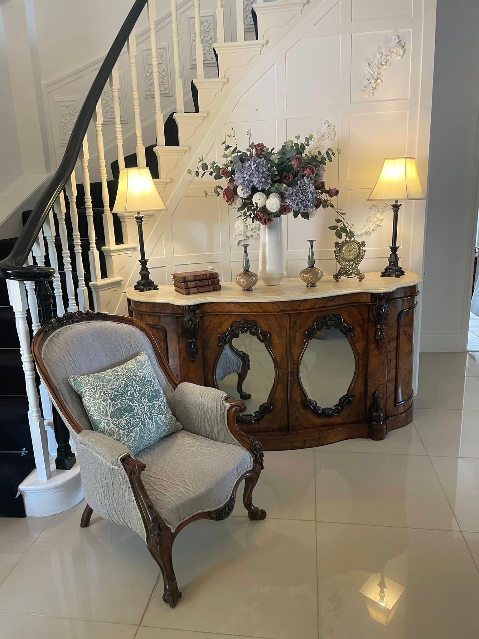 ??Outstanding quality antique Victorian burr walnut marble top credenza having a white serpentine shaped marble top with a double moulded edge above a pair of quality burr walnut oval carved mirrored doors opening to reveal a polished shelf interior