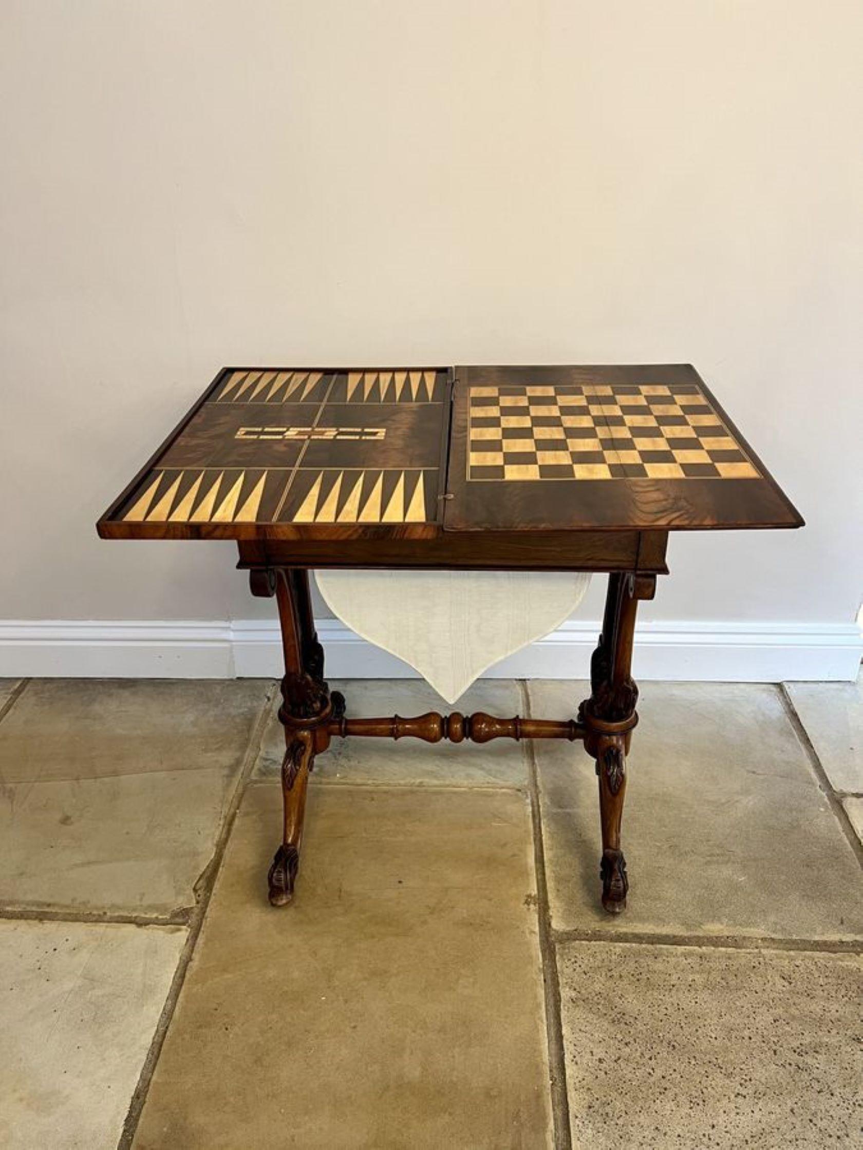 Outstanding quality antique Victorian burr walnut inlaid floral marquetry games table, having a outstanding quality burr walnut inlaid floral marquetry swizzle top opening to reveal a inlaid chessboard and backgammon board above a fitted drawer and