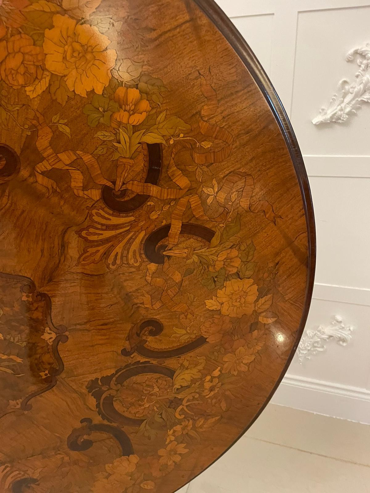Outstanding quality antique Victorian burr walnut marquetry inlaid centre/dining table having an incredible quality circular burr walnut floral marquetry inlaid top with a thumb moulded edge supported by a quality carved solid walnut turned column