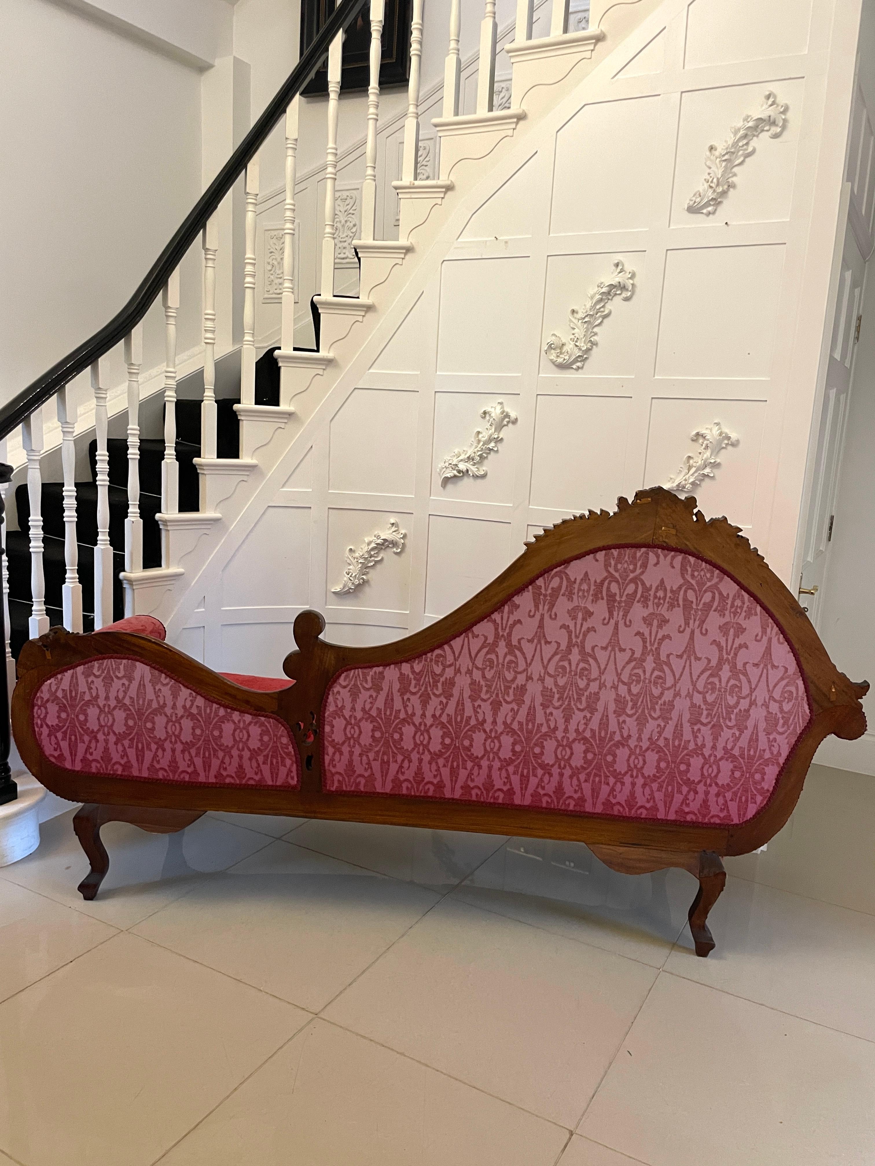 Outstanding quality antique Victorian carved mahogany chaise longue having an outstanding quality mahogany shaped back with carved scrolls, flowers, leaves and grapes, scroll shaped arms, carved frieze with flowers standing on shaped carved cabriole