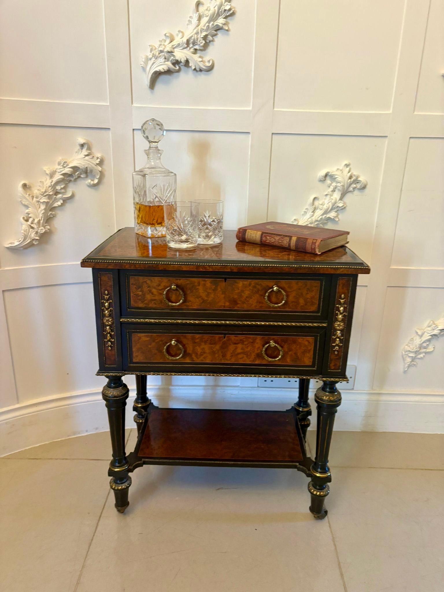 Outstanding quality antique Victorian freestanding amboyna wood side/lamp table having an exceptional quality amboyna and ebony rectangular shaped hinged top opening to reveal a storage compartment above a single drawer, original ring handles,