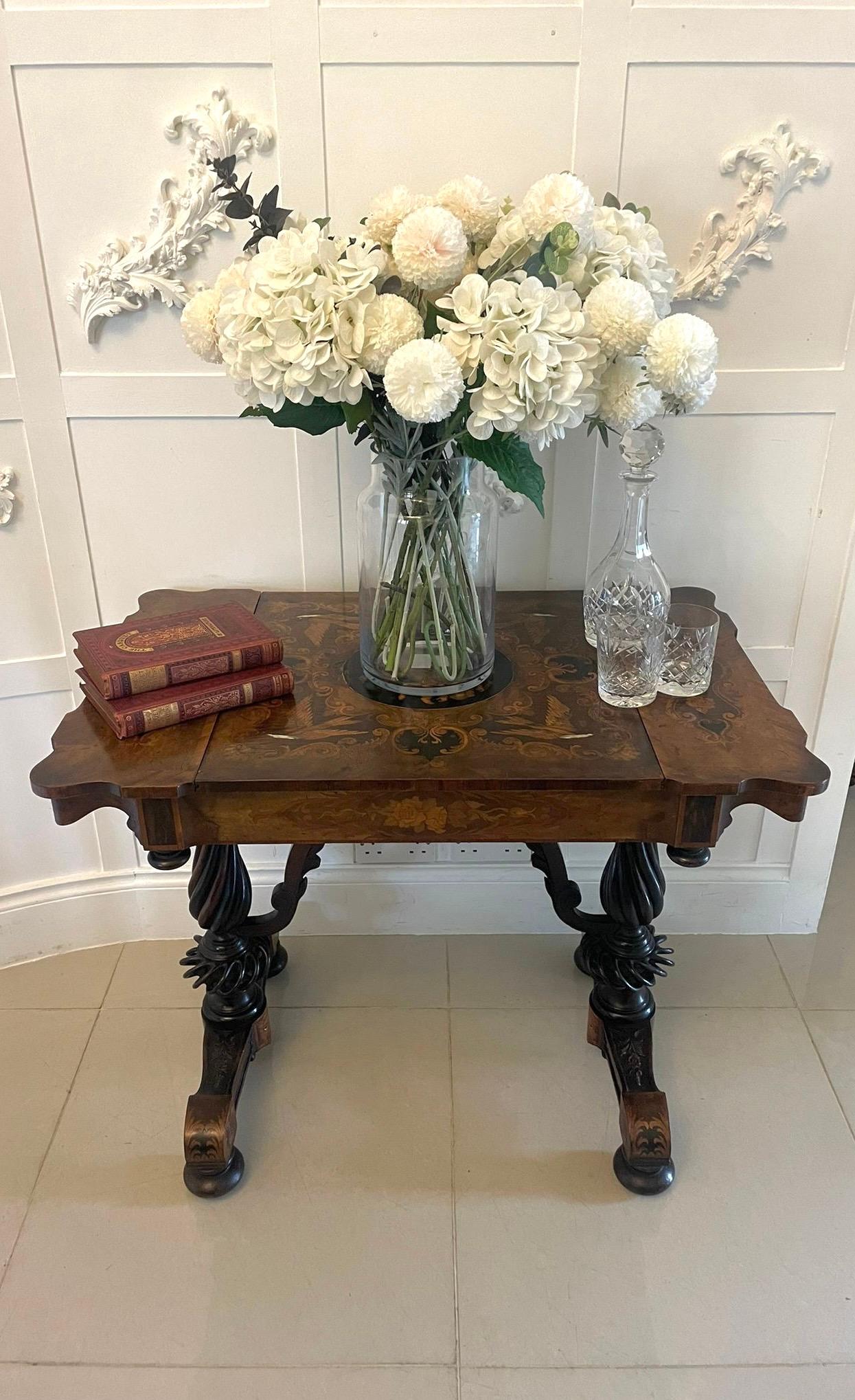 Outstanding quality antique Victorian marquetry inlaid burr walnut games/side table having a remarkable quality marquetry inlaid burr walnut shaped top with a sliding centre revealing an inlaid chessboard and the original leather backgammon board,