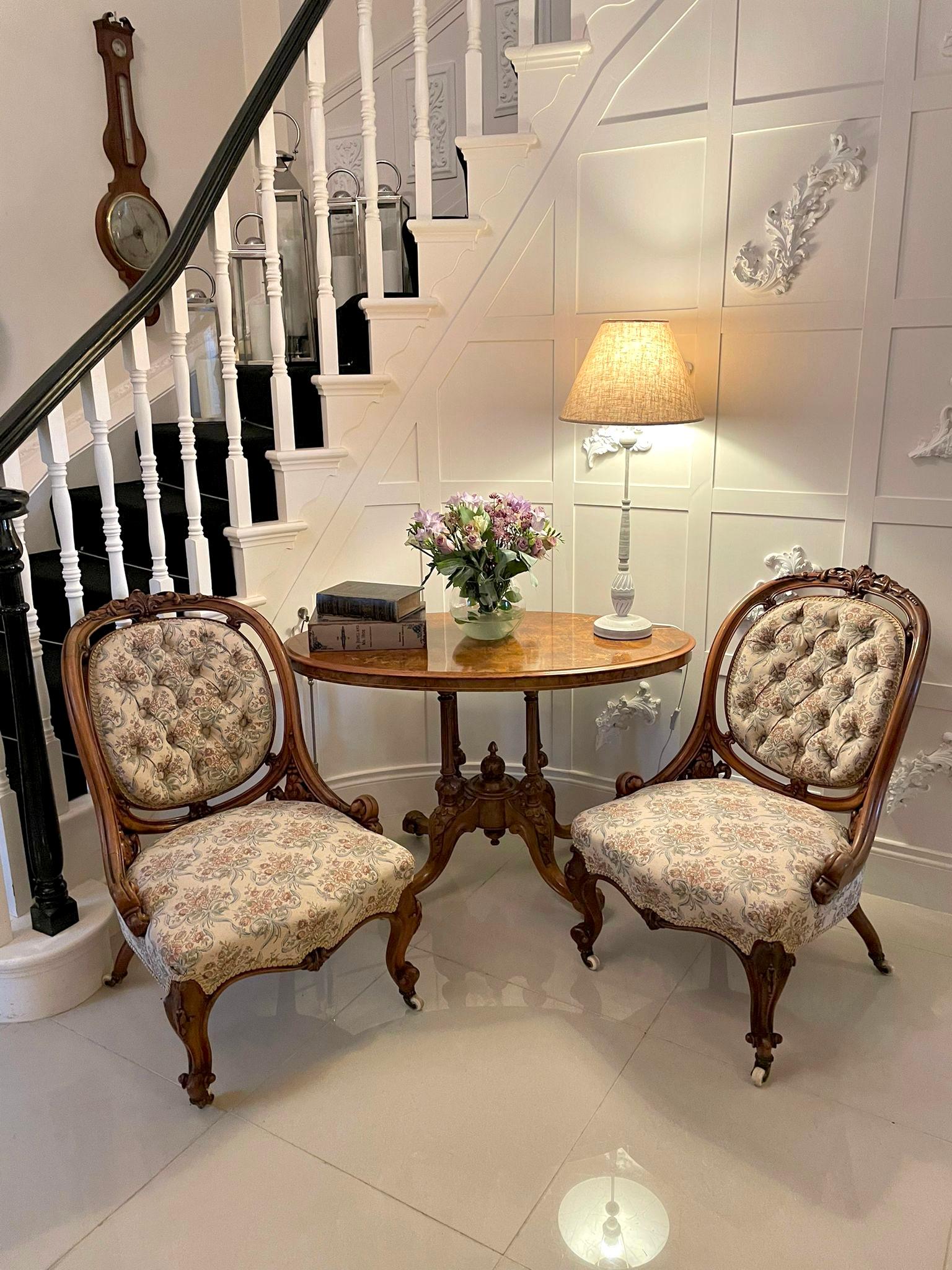 Outstanding quality antique Victorian pair of carved walnut chairs having outstanding quality carved walnut oval backs, carved walnut supports, carved walnut serpentine shaped front rail and raised on shaped carved walnut cabriole legs to the front