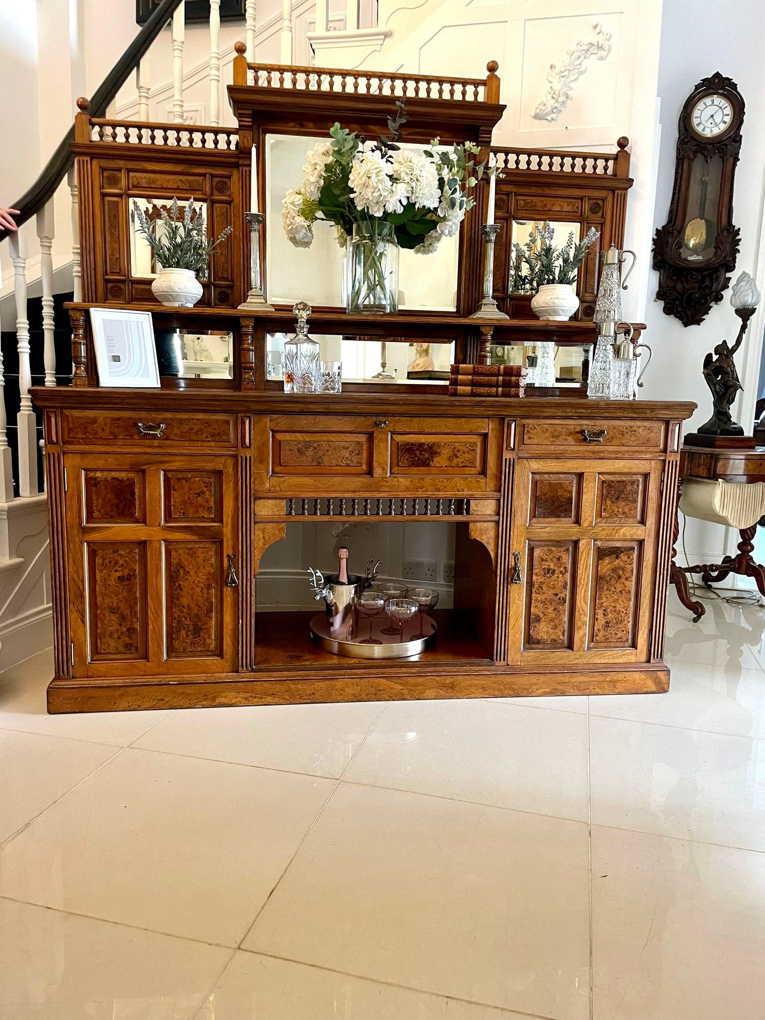 Outstanding quality antique Victorian pollard oak mirror back sideboard by James Schoolbred and Co. having six bevelled edged mirrors, turned oak spindle galleries, shelf supported by turned columns, outstanding quality pollard oak top above a drop