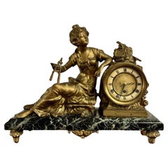 Pendule de cheminée à figures en étain de qualité exceptionnelle, de l'époque victorienne.