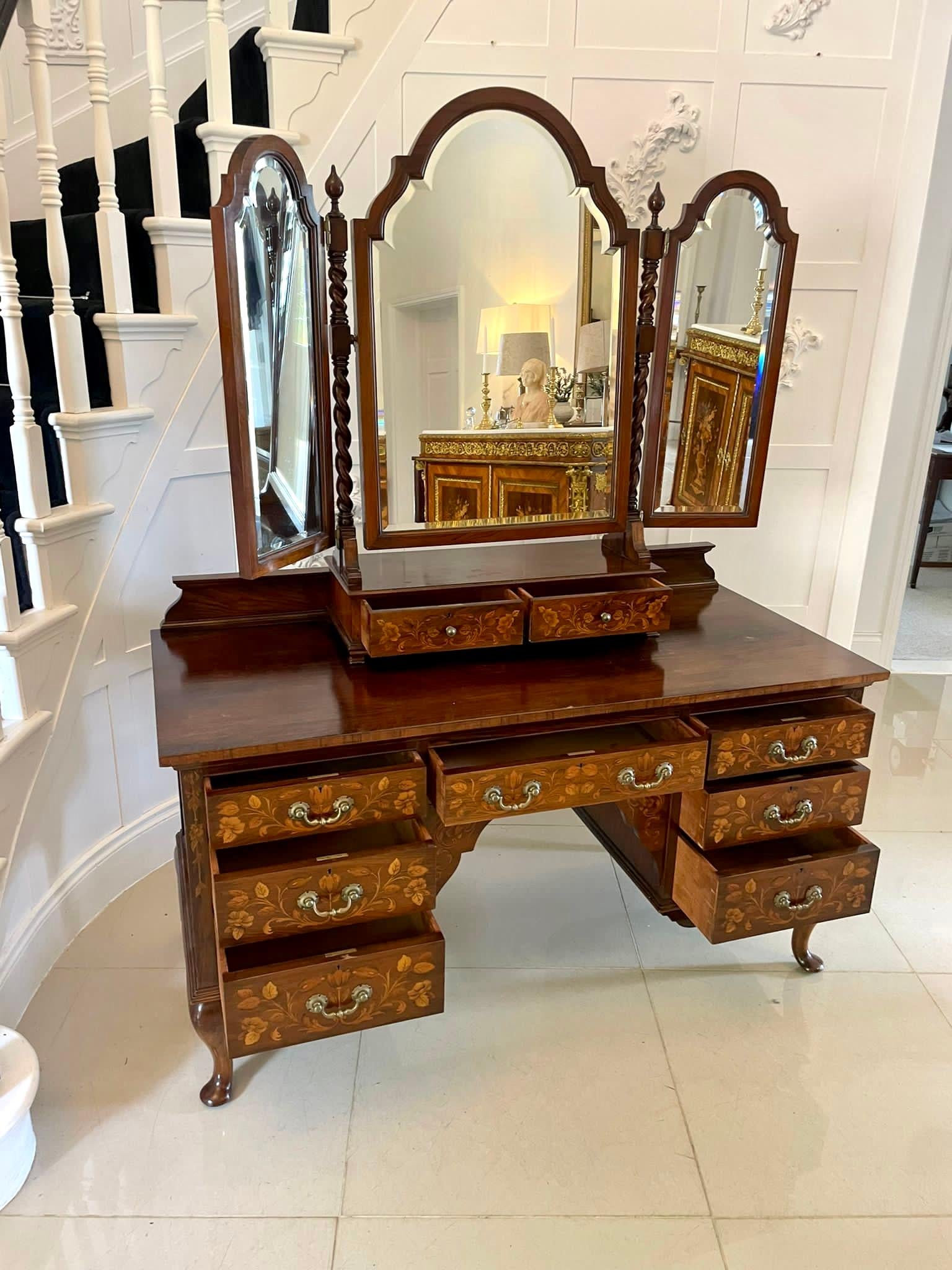 Outstanding quality antique Victorian figured walnut floral marquetry inlaid dressing table 
having a shaped adjustable bevelled edge triple dressing mirror with solid walnut barley twist supports and two floral marquetry inlaid drawers with