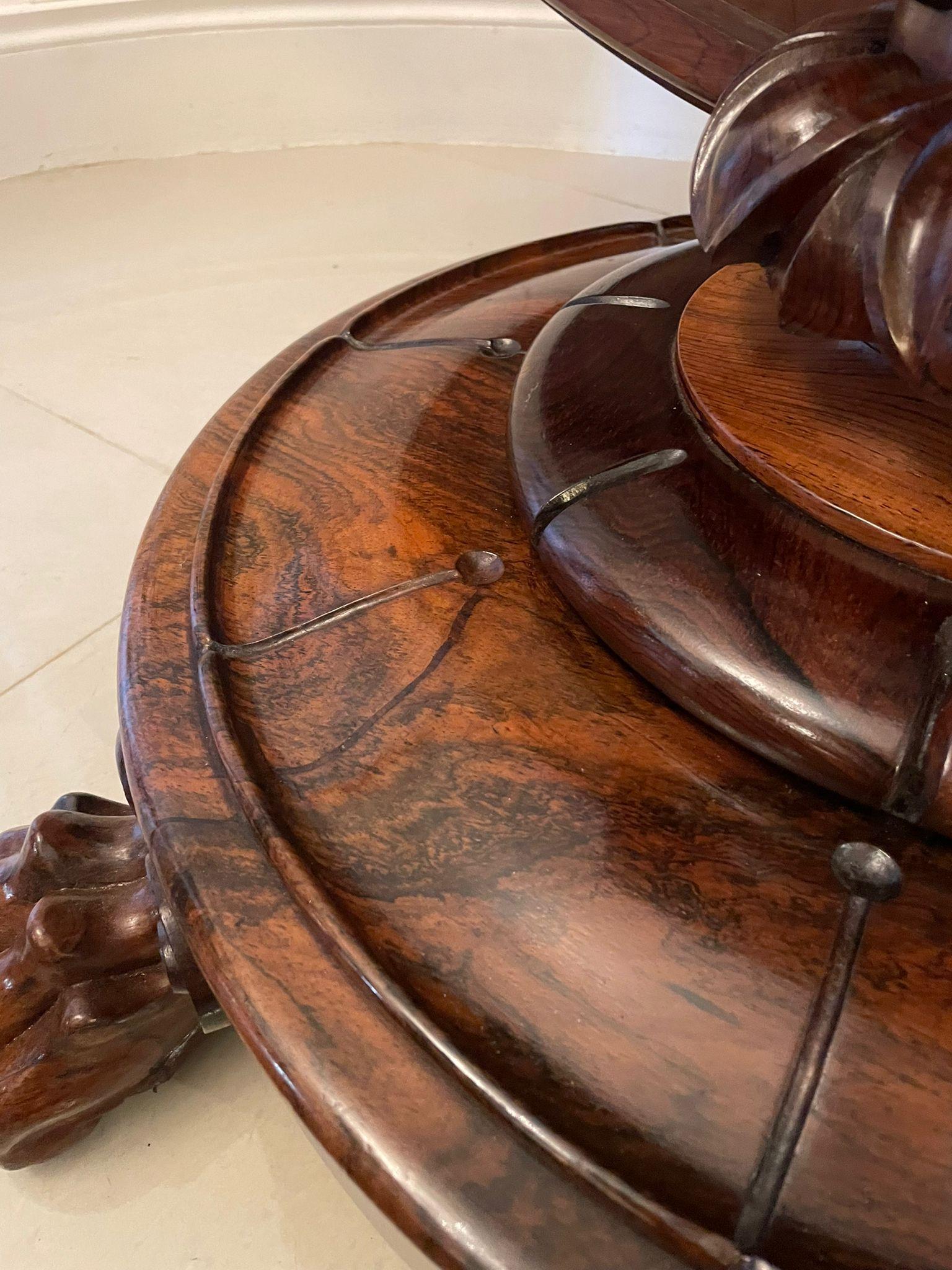 Outstanding quality antique William IV circular rosewood centre table having a superior quality rosewood circular top boasting the most fabulous colour supported by a magnificent shaped carved solid rosewood pedestal. It stands on a beautifully