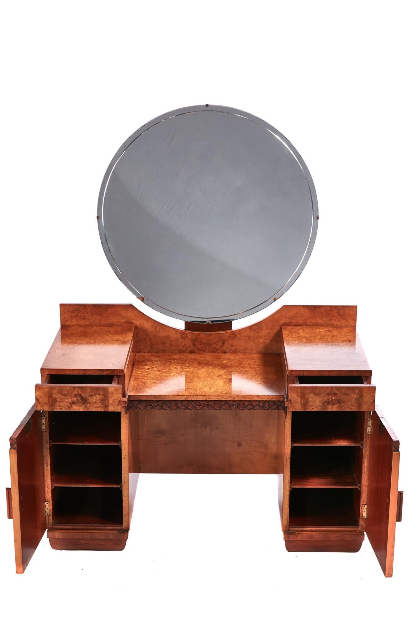 Outstanding quality Art Deco bird’s-eye maple dressing table having a large round beveled edge mirror. Fantastic quality bird’s-eye maple top 2 frieze drawers, 2 cupboard doors original handles with carved leaf decoration standing on a shaped plinth