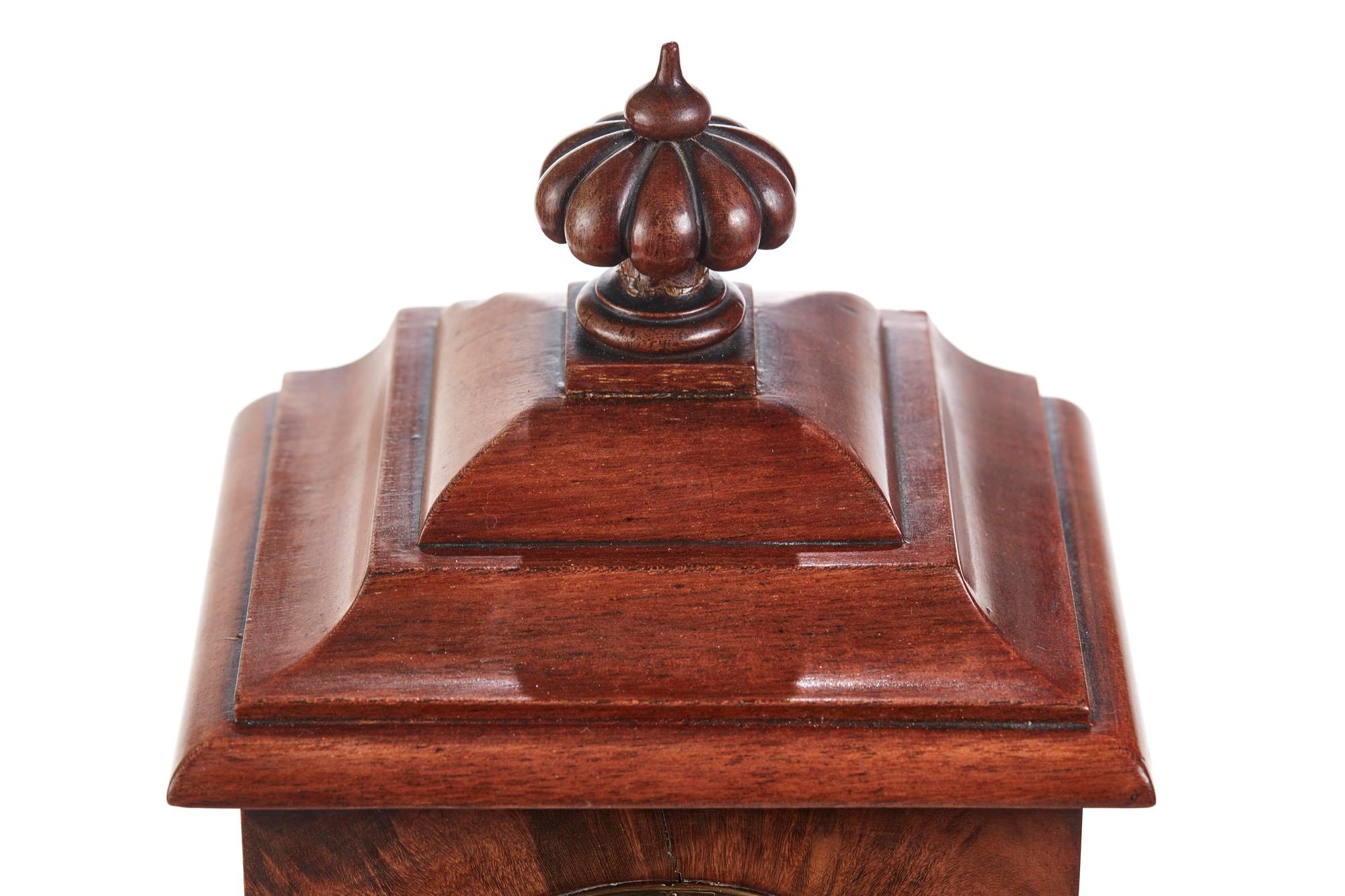 Outstanding quality burr walnut Victorian mantle clock having a reeded shaped finual, shaped top. Burr walnut case with a round silver dial, 8 day movement all original and in perfect working order with original key.