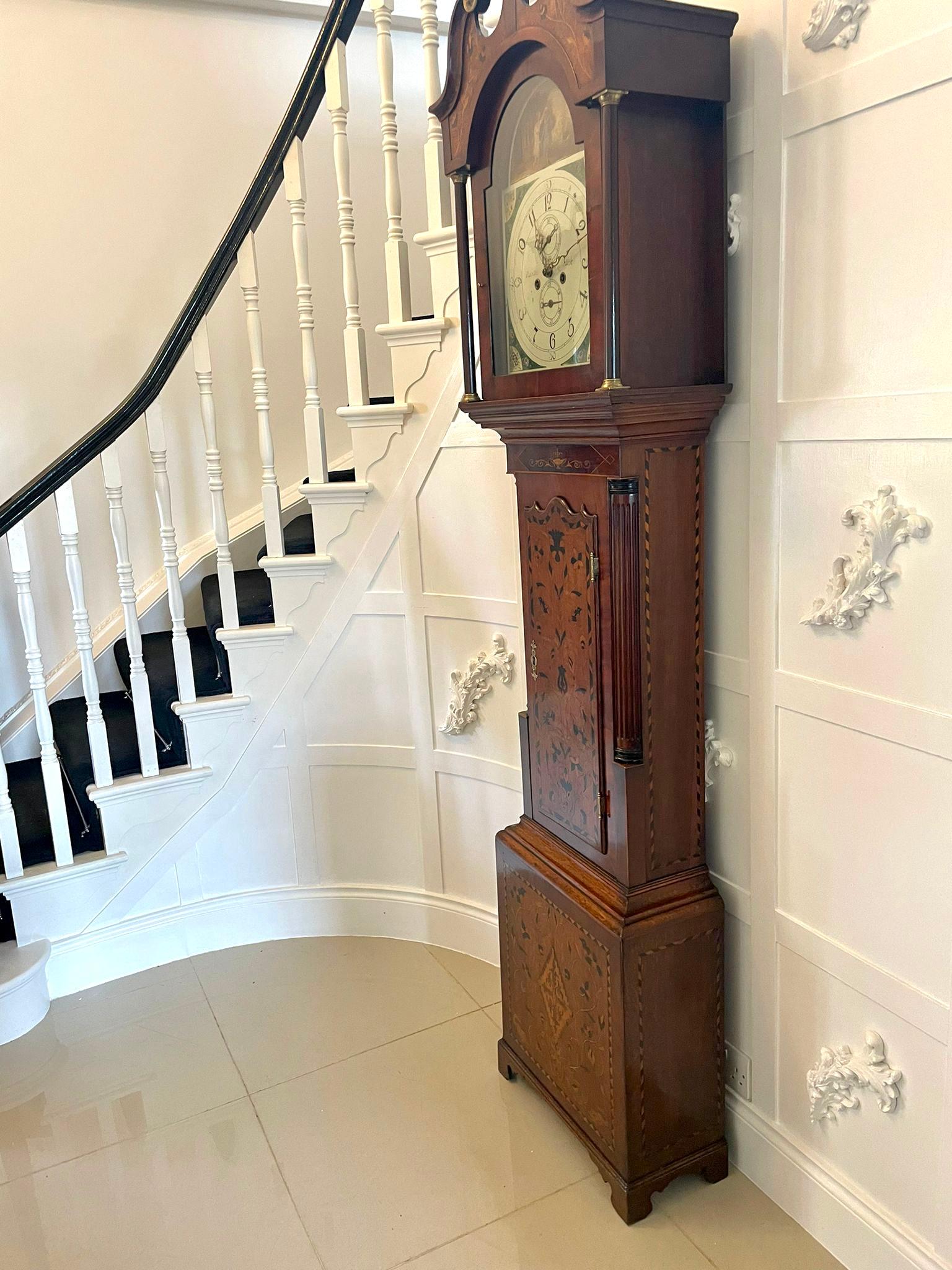 Outstanding antique quality inlaid marquetry oak and mahogany George IIIl longcase clock having an outstanding inlaid marquetry oak and mahogany case with birds, flowers, leaves and an urn, swan neck pediment, turned columns, arched glazed door,