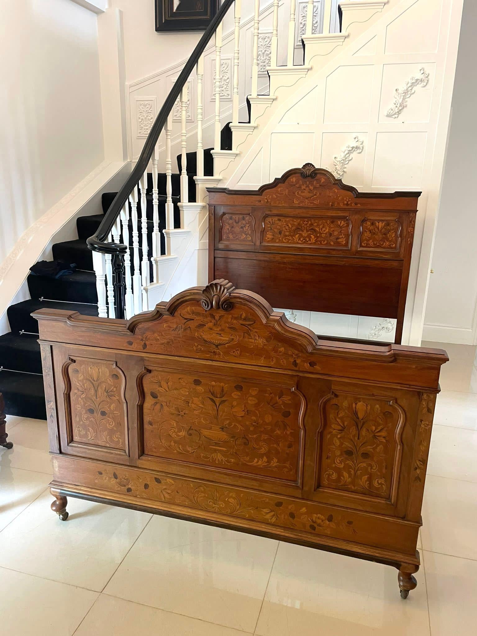 Outstanding quality King size antique Victorian figured walnut floral marquetry inlaid bed having shaped carved solid walnut tops above three shaped outstanding quality figured walnut floral marquetry inlaid panels to each end standing on shaped