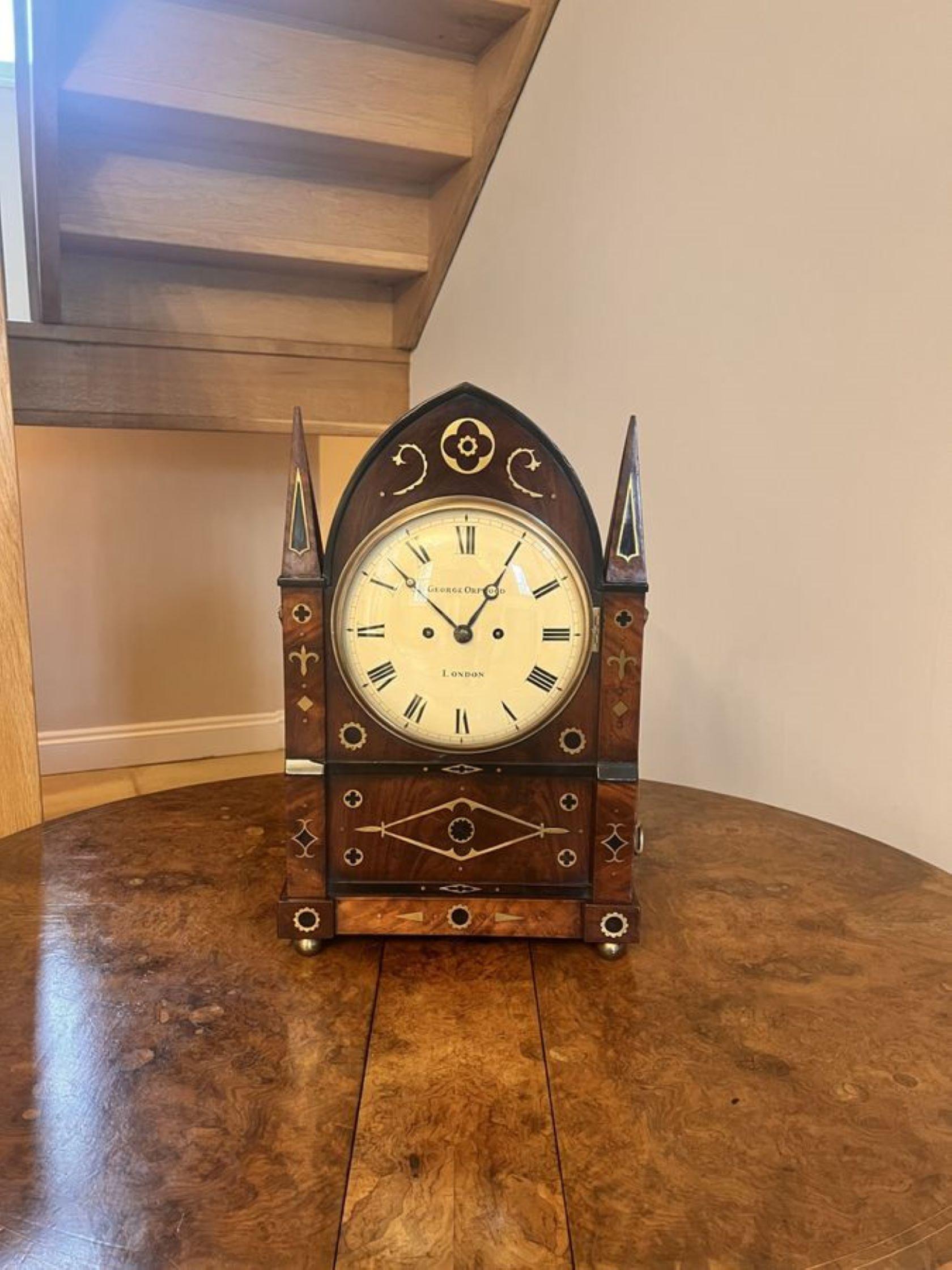 Outstanding quality large antique regency brass inlaid bracket clock by George Orpwood, having an outstanding quality unusual architecture design mahogany case inlaid with ebony and fantastic brass inlay, brass frets panels and lion mask handles to