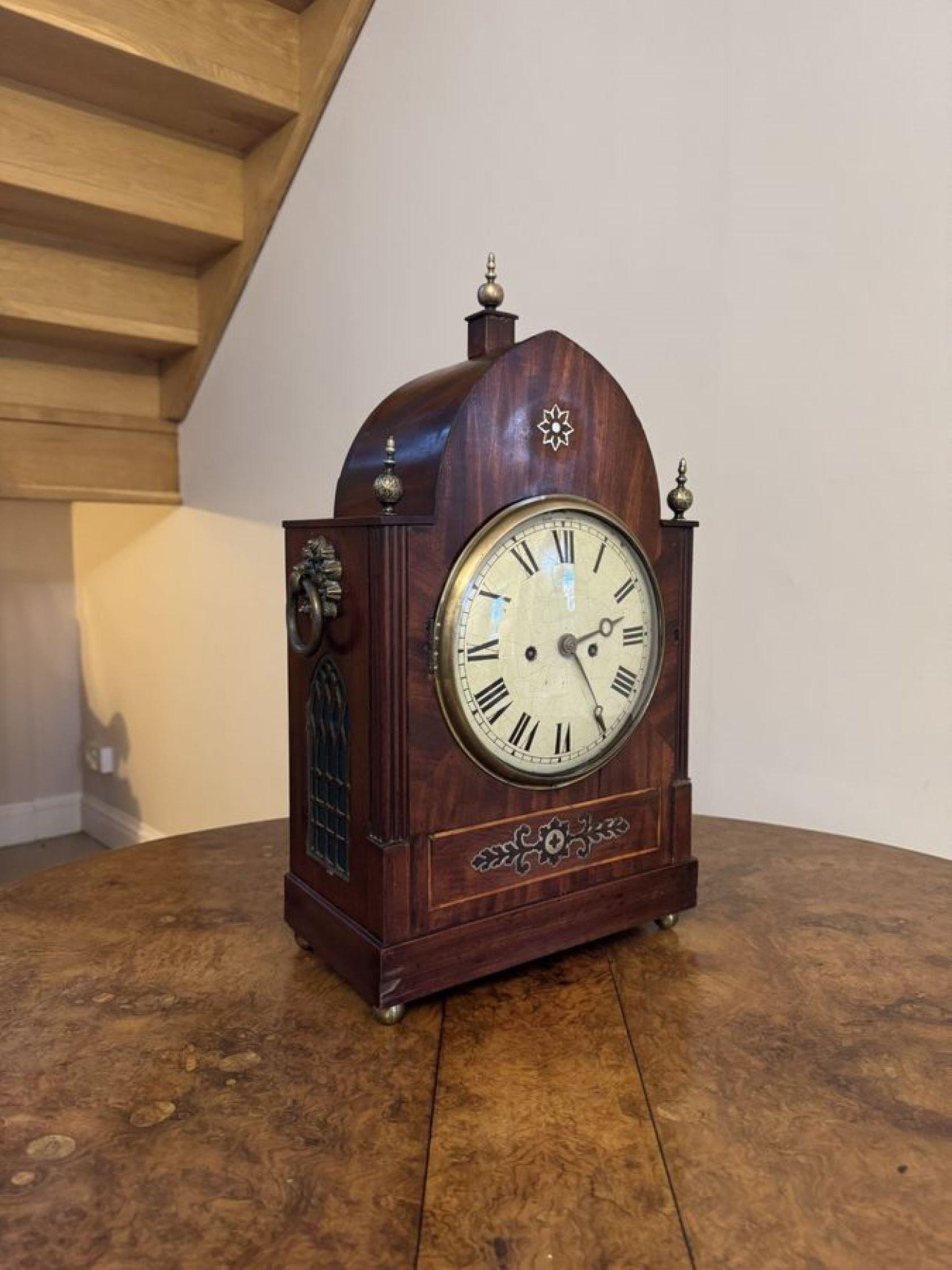 Outstanding quality large antique Regency mahogany brass inlaid bracket clock having an early 19th century Regency mahogany brass inlaid Gothic arched cased with a round dial with Roman numerals and the original hands surrounded by a brass bezel,