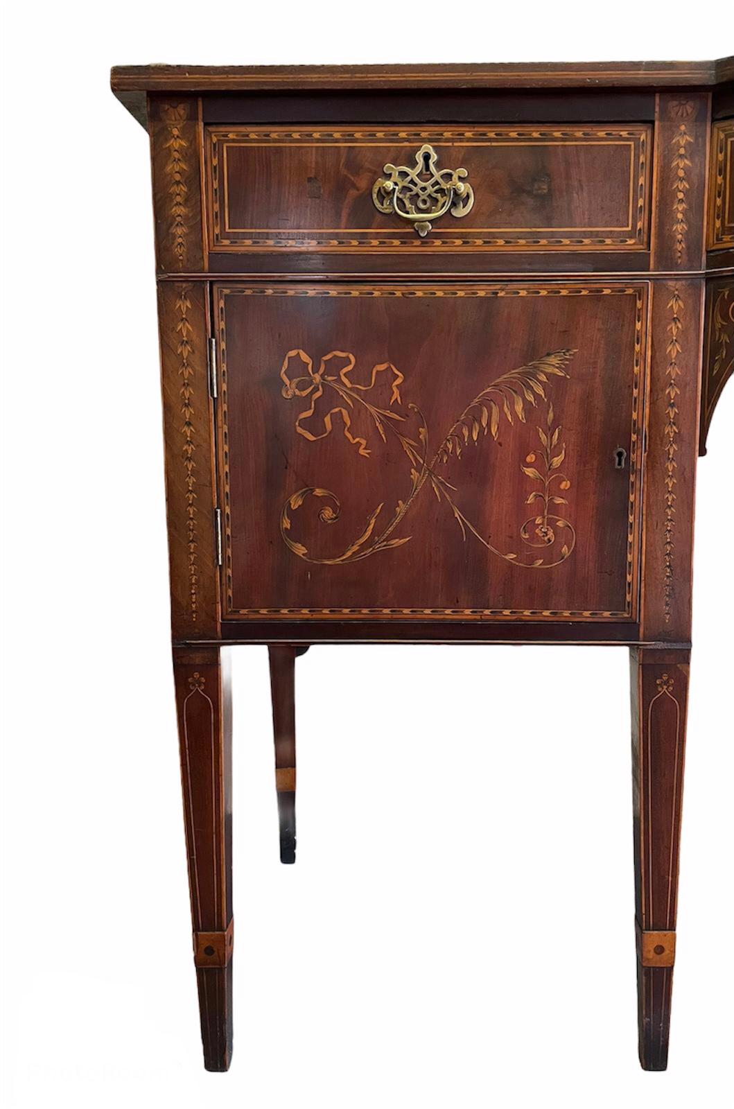 Outstanding quality antique large George III inlaid mahogany sideboard having a magnificent mahogany inlaid gallery back and impressive mahogany bow fronted shaped top with a pretty satinwood inlaid edge. It boasts one long bow fronted drawer to the