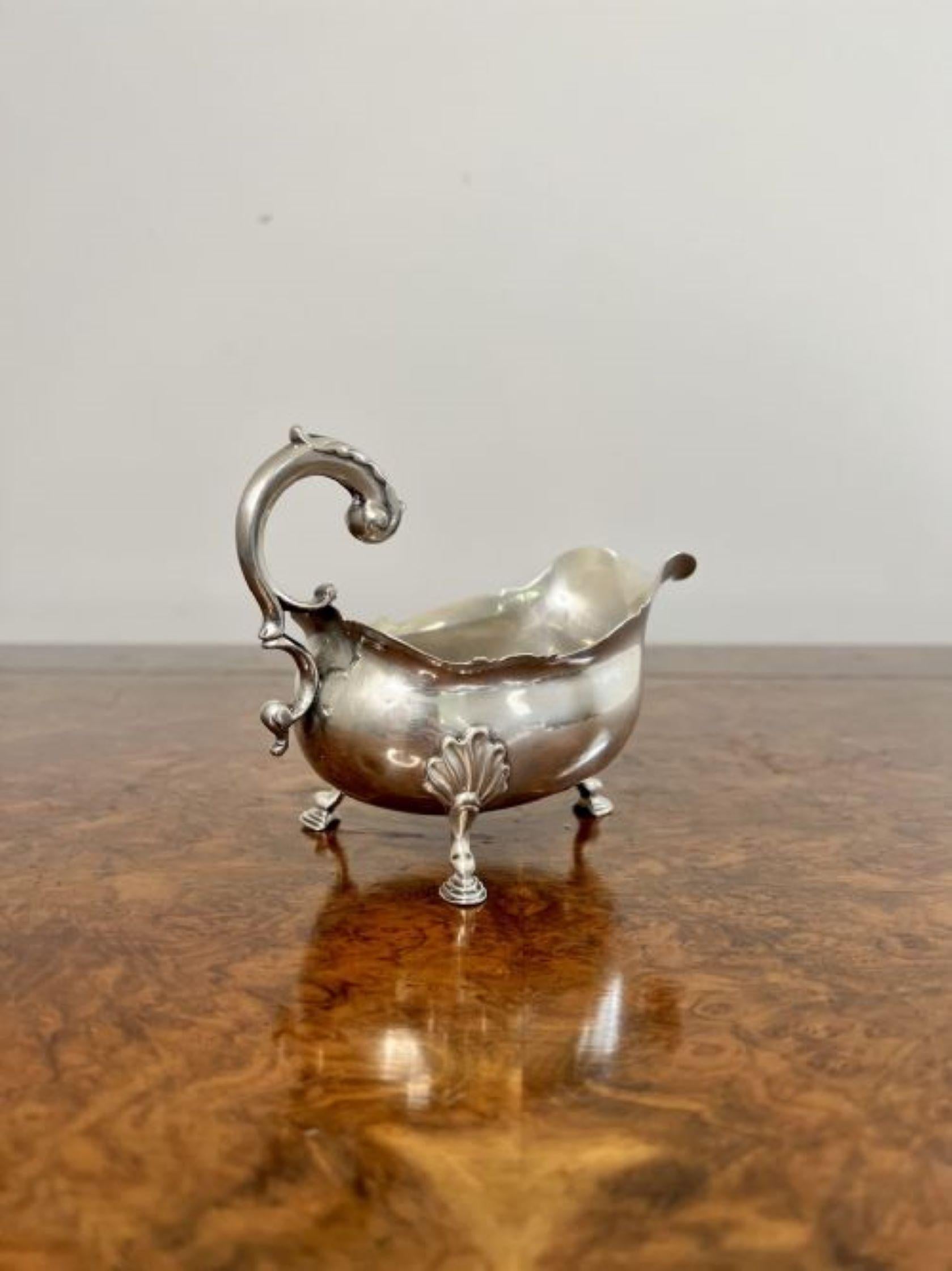 Outstanding quality pair of antique George III silver sauce boats having an outstanding quality pair of solid silver sauce boats with fantastic scrolled handles to the back, shaped bodies raised on three shell relief hoof feet, marks to the base,