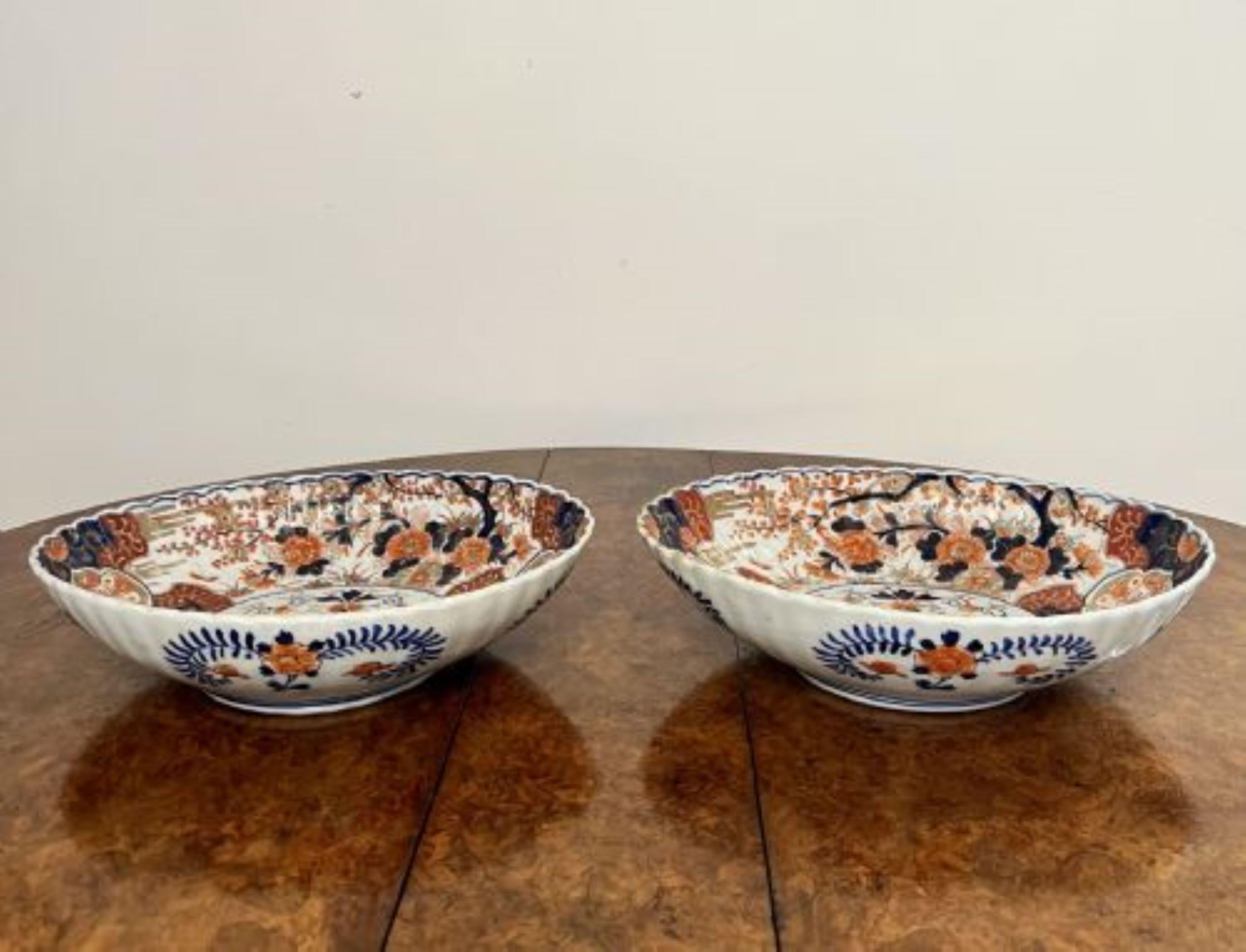 Outstanding quality pair of antique Japanese Imari large scalloped edge bowls having an outstanding quality pair of antique Japanese Imari scalloped edge bowls, oval in shape, decorated with flowers, trees and scrolls in fantastic red, blue, white