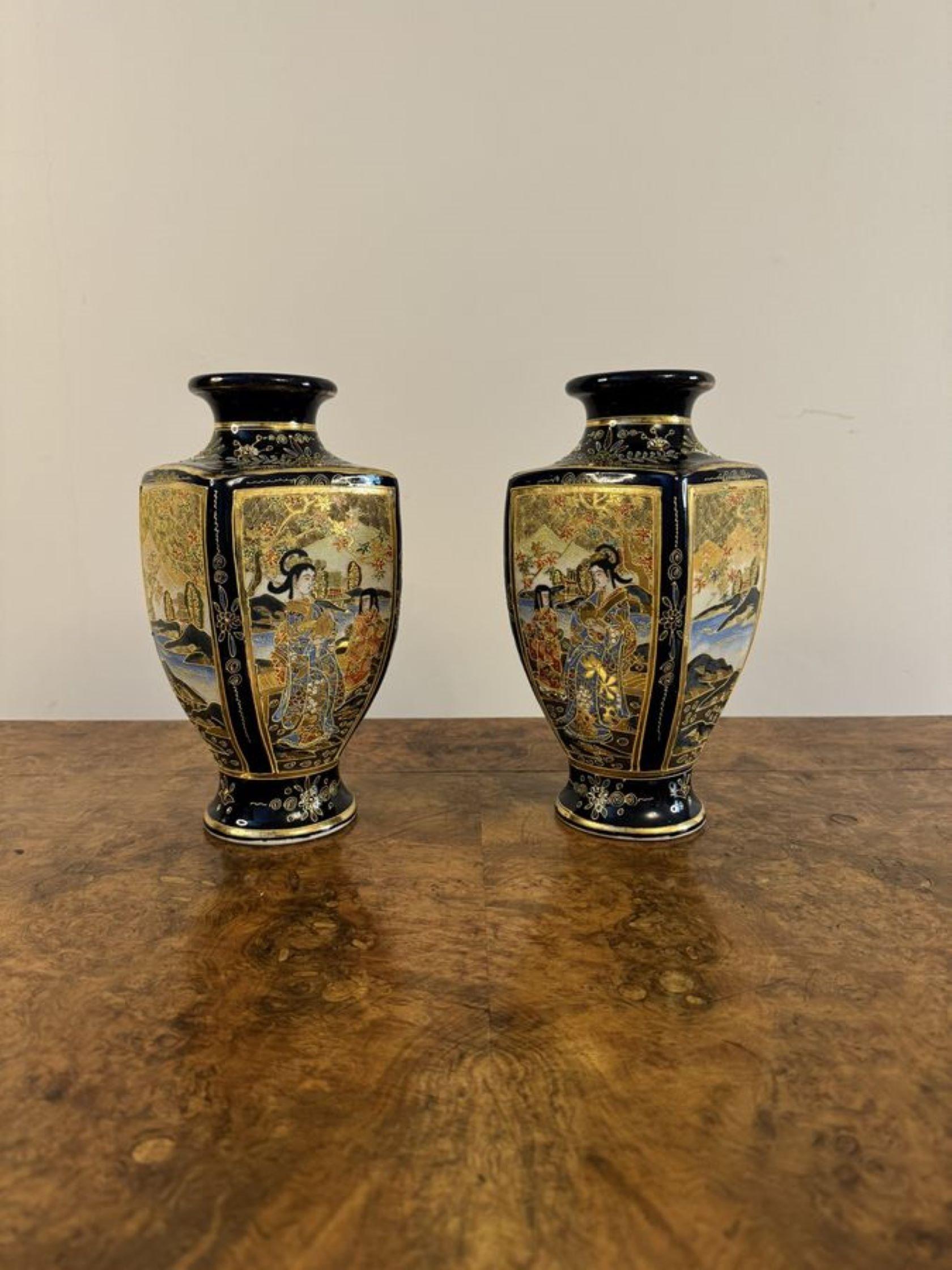 Outstanding quality pair of antique Japanese satsuma vases having a quality pair of shaped Japanese Satsuma vases with gilded circular shaped tops, with fantastic detailed hand painted decoration of figural and landscape scenes within blue and gold