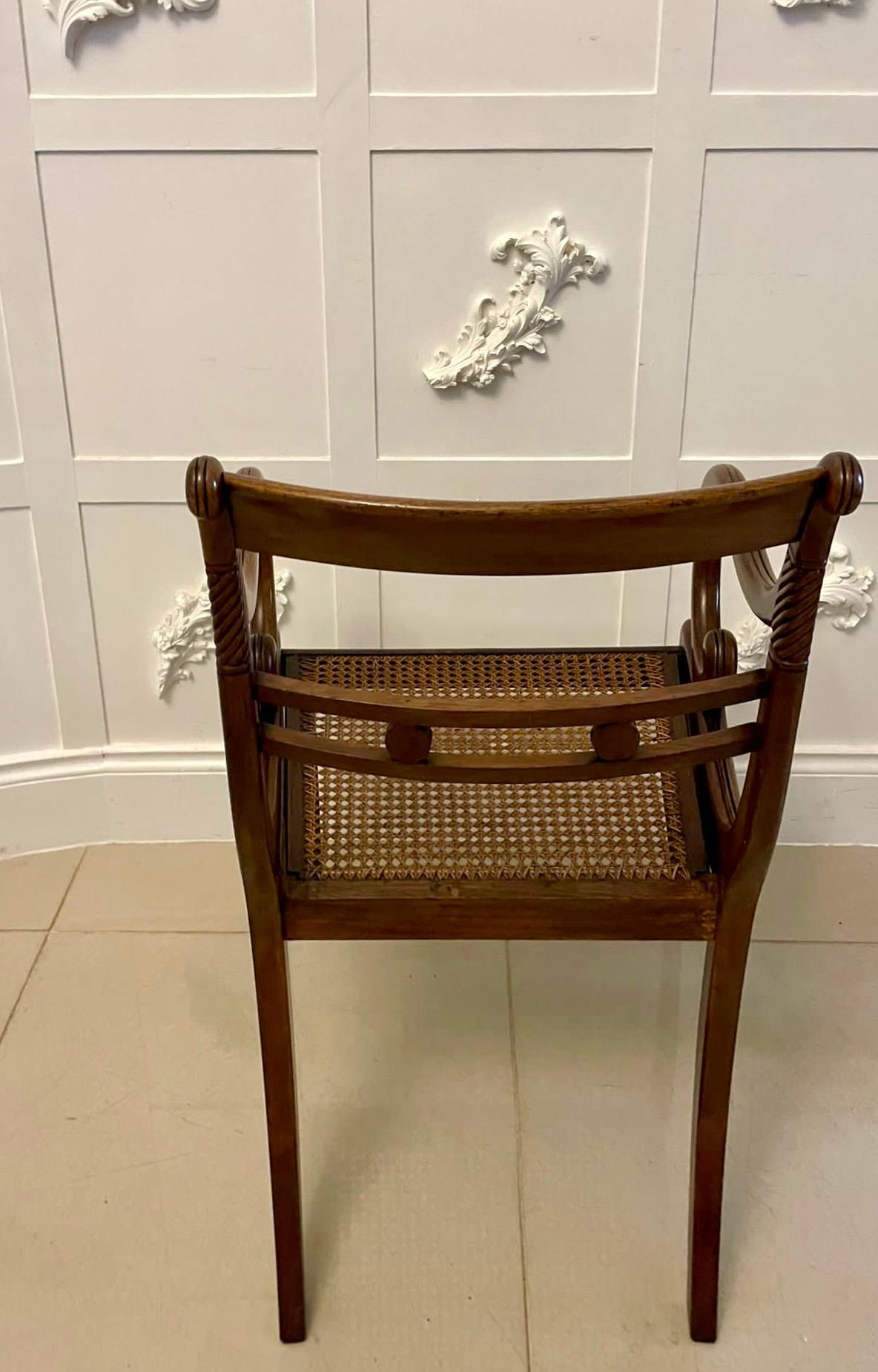 Outstanding quality set of 10 antique Regency mahogany dining chairs consisting of a pair of elbow chairs with scroll shaped open arms and 8 single chairs having an outstanding quality carved top rail and centre splat, rope twist and reeded