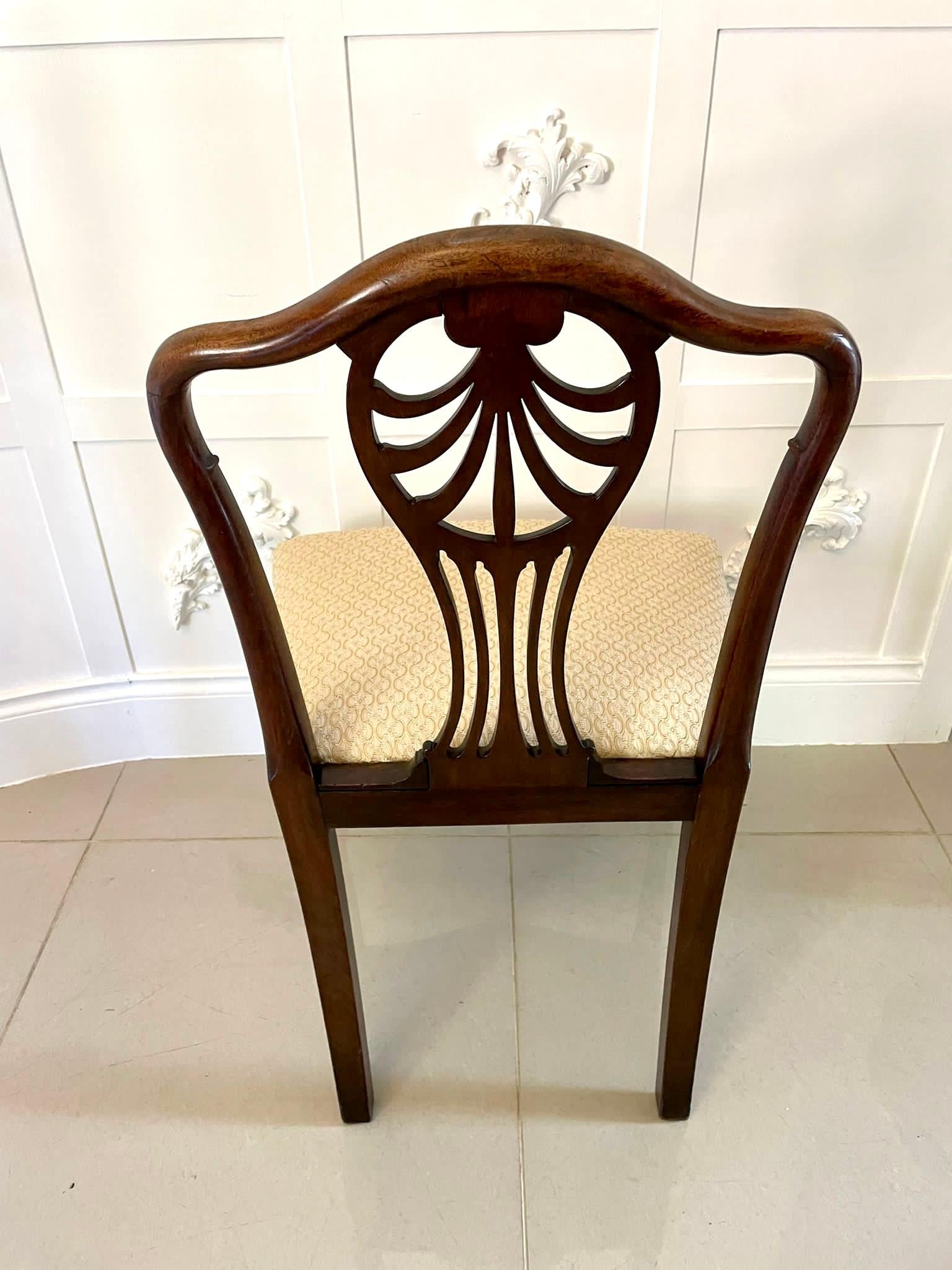Outstanding quality set of four antique Victorian mahogany dining chairs having outstanding quality carved backs with a pierced carved shaped splat to the centre, newly reupholstered serpentine shaped seats in a quality fabric standing on a square