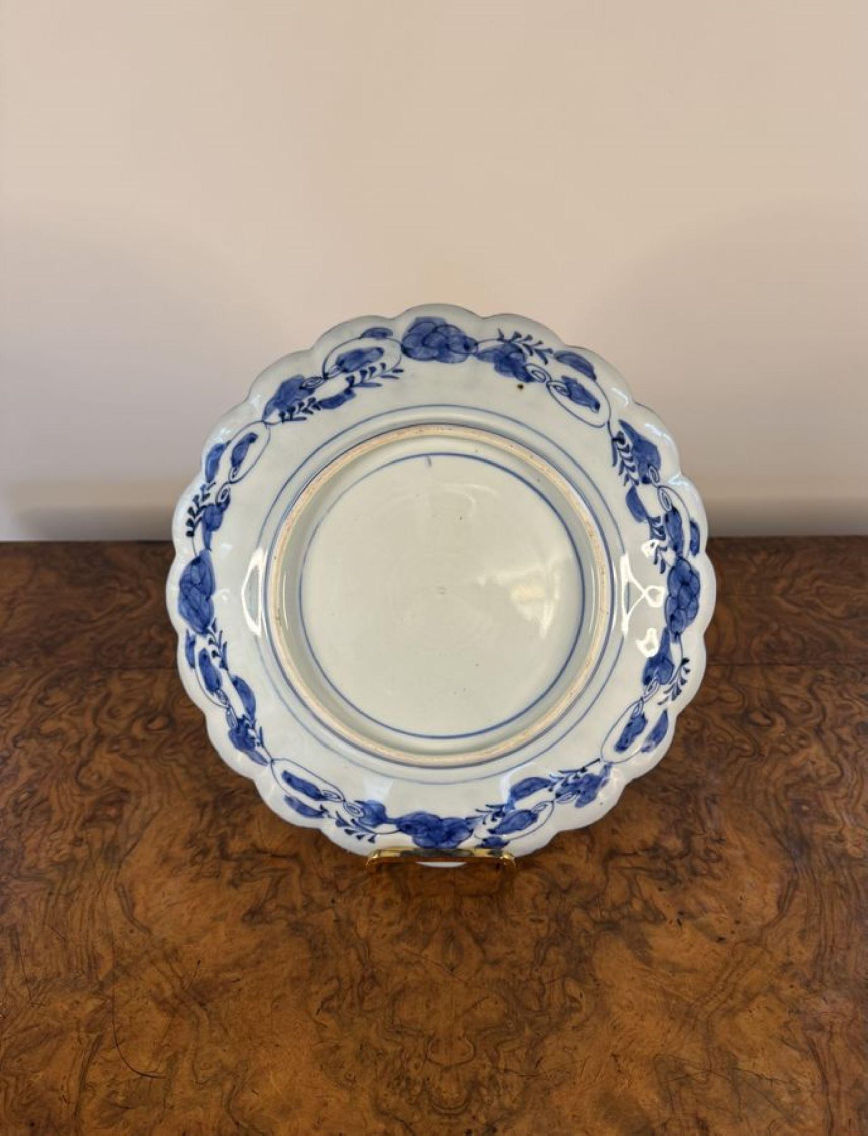 Outstanding quality trio of antique Japanese imari plates, having a quality trio of antique Japanese imari plates with scalloped shaped edges, decorated with a basket of flowers to the centre surrounded by panels decorated with flowers, leaves and