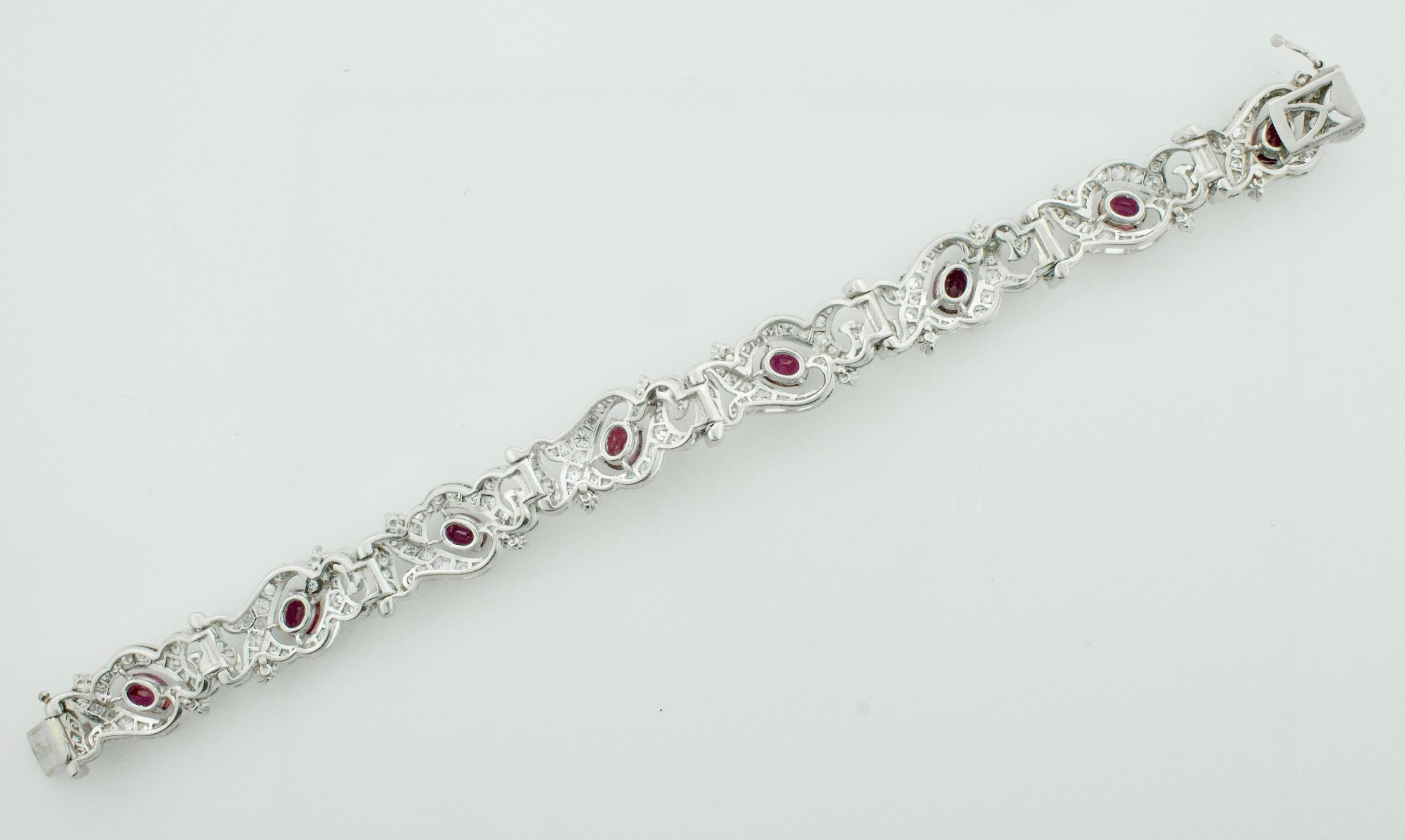 Outstanding Ruby and Diamond Bracelet Circa 1940's in Platinum
Eight Oval Rubies Weighing 6.50 Carats Approximately  [bright with no imperfections visible to the naked eye]
Two Hundred and Fifty Eight Round Cut Diamonds Weighing 7.00 Carats
