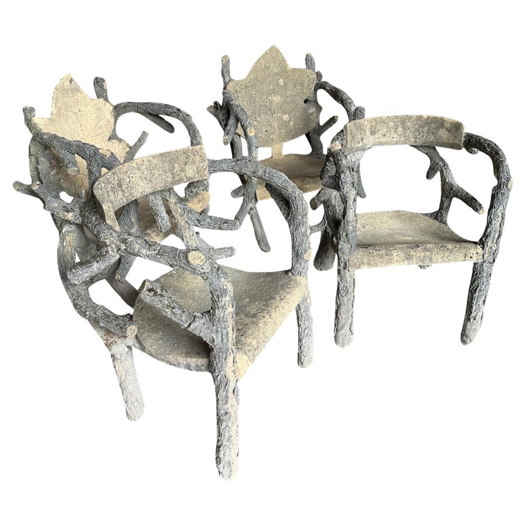 Un ensemble exceptionnel de 4 chaises de jardin en Faux Bois de la région de Provence en France.  Merveilleusement construit en ciment avec de magnifiques détails de feuillage et de branches.  L'affirmation de tout jardin. Une paire mesure 34 7/8