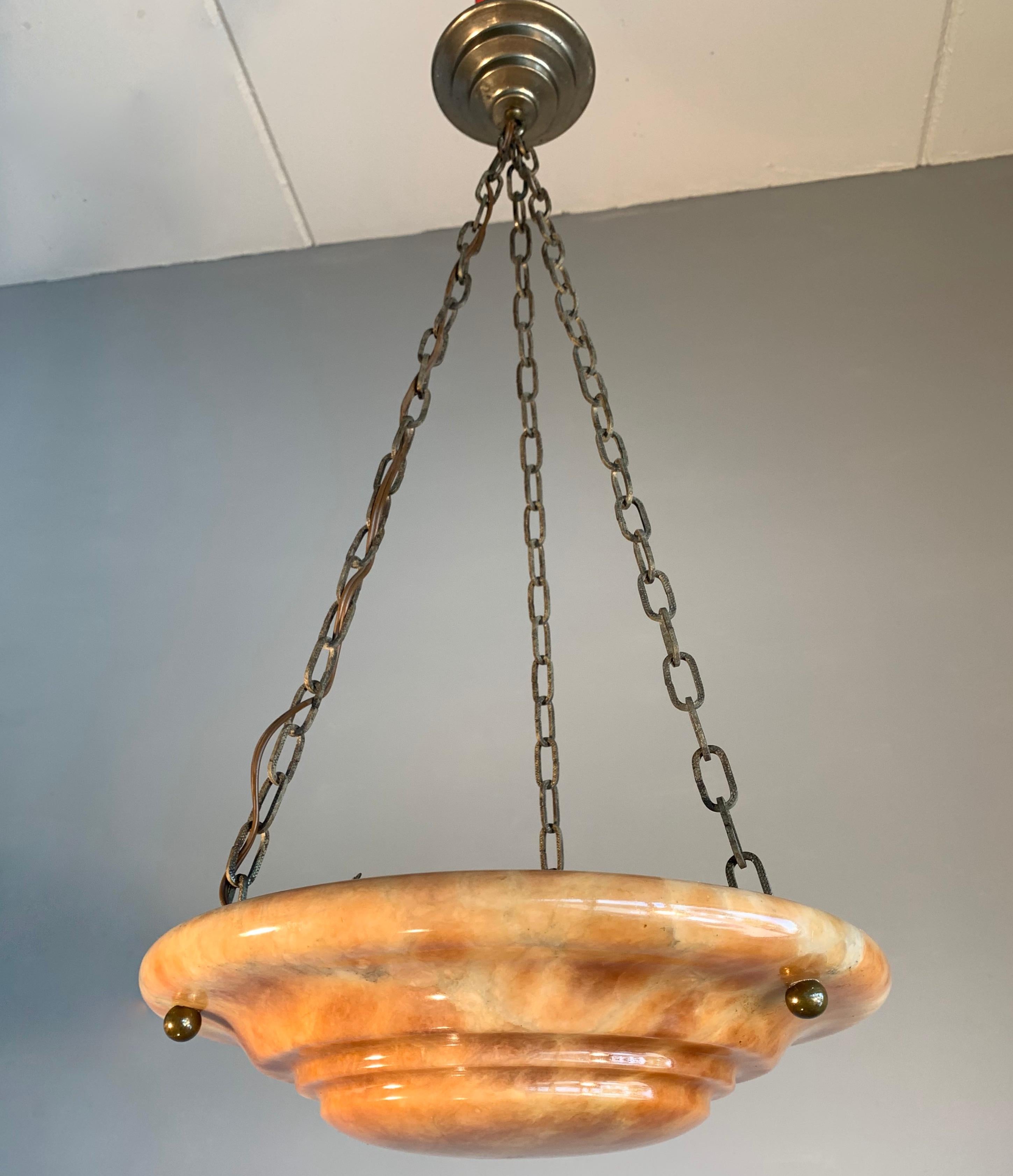 Striking antique light fixture for an entry hall, bedroom or any other small room.

With early 20th century light fixtures being one of our specialties, we always love finding timeless pendants and flushmounts we have never seen before. This