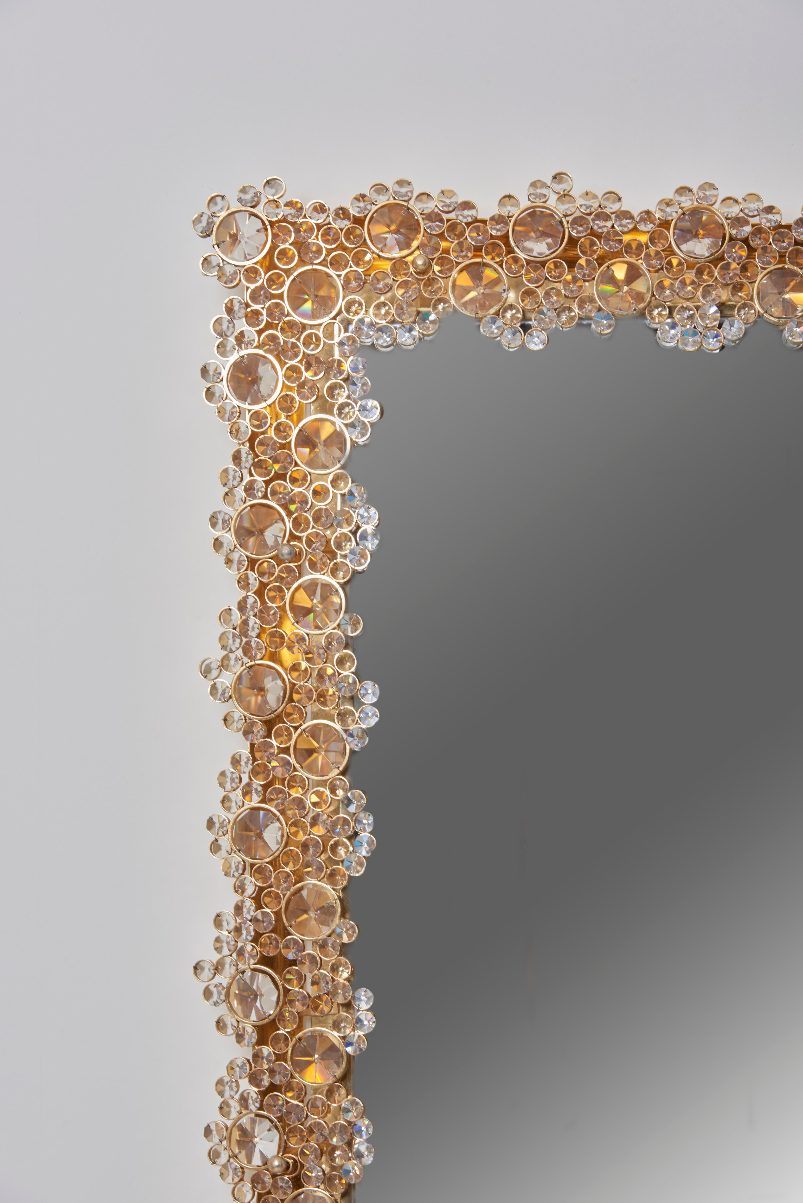 Outstanding illuminated mirror, Model S100W by Palwa.
Made of gold-plated metal and crystal glass.
28 x E14 bulbs.

We also have a matching round mirror in stock