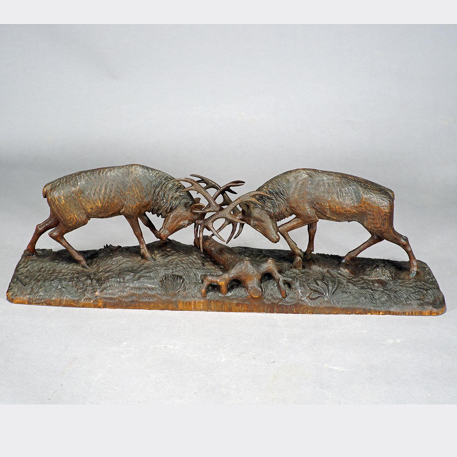 Black Forest Outstanding Wooden Carved Fighting Stags by K. Bach, 1946 For Sale