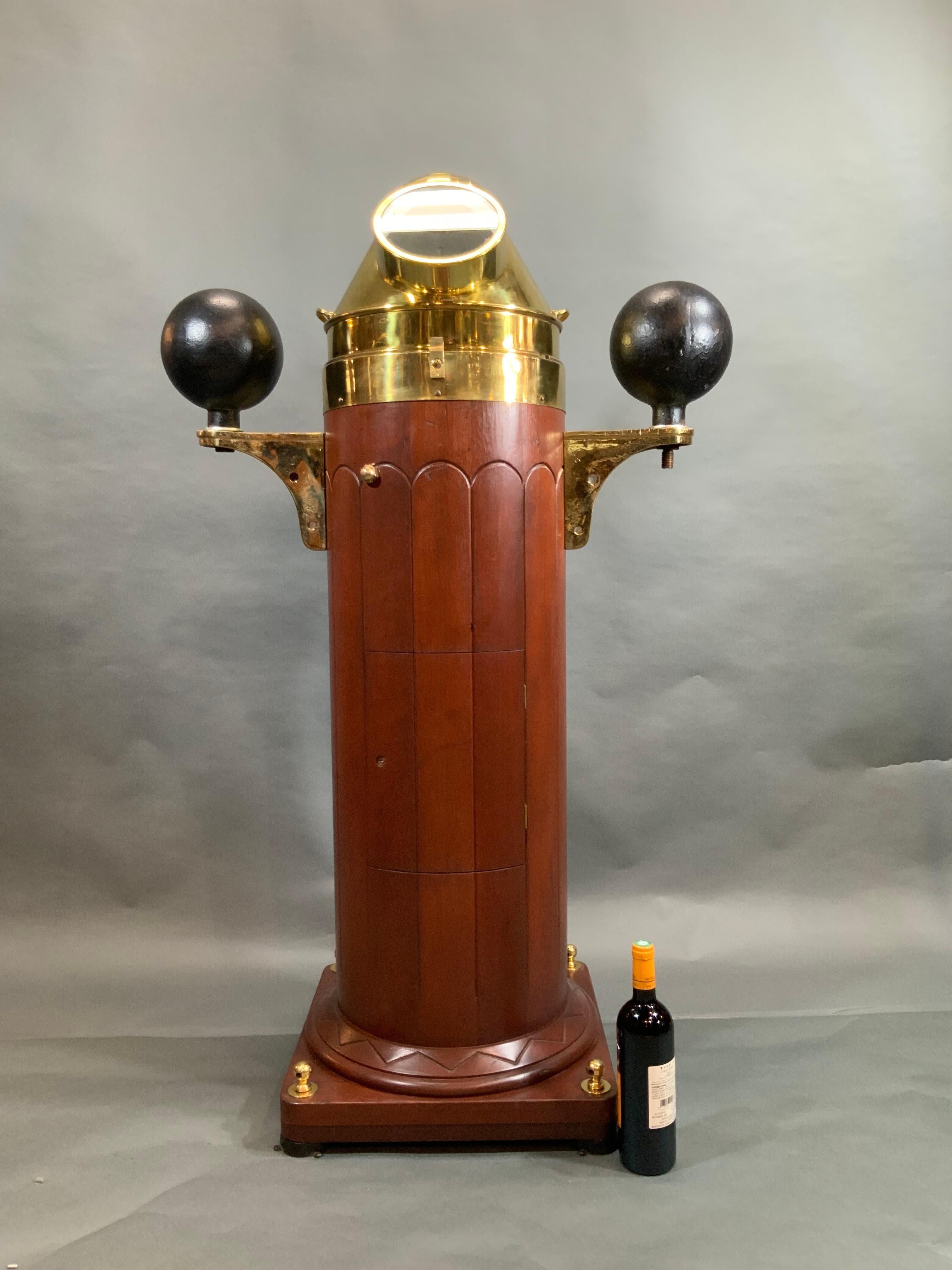 Classic yacht binnacle with a fabulous mahogany base with exceptional detail and a beautiful finish. The brasses are highly polished and lacquered. The interior has been wired with lighting by us. Baker Lyman gimballed compass, also polished and